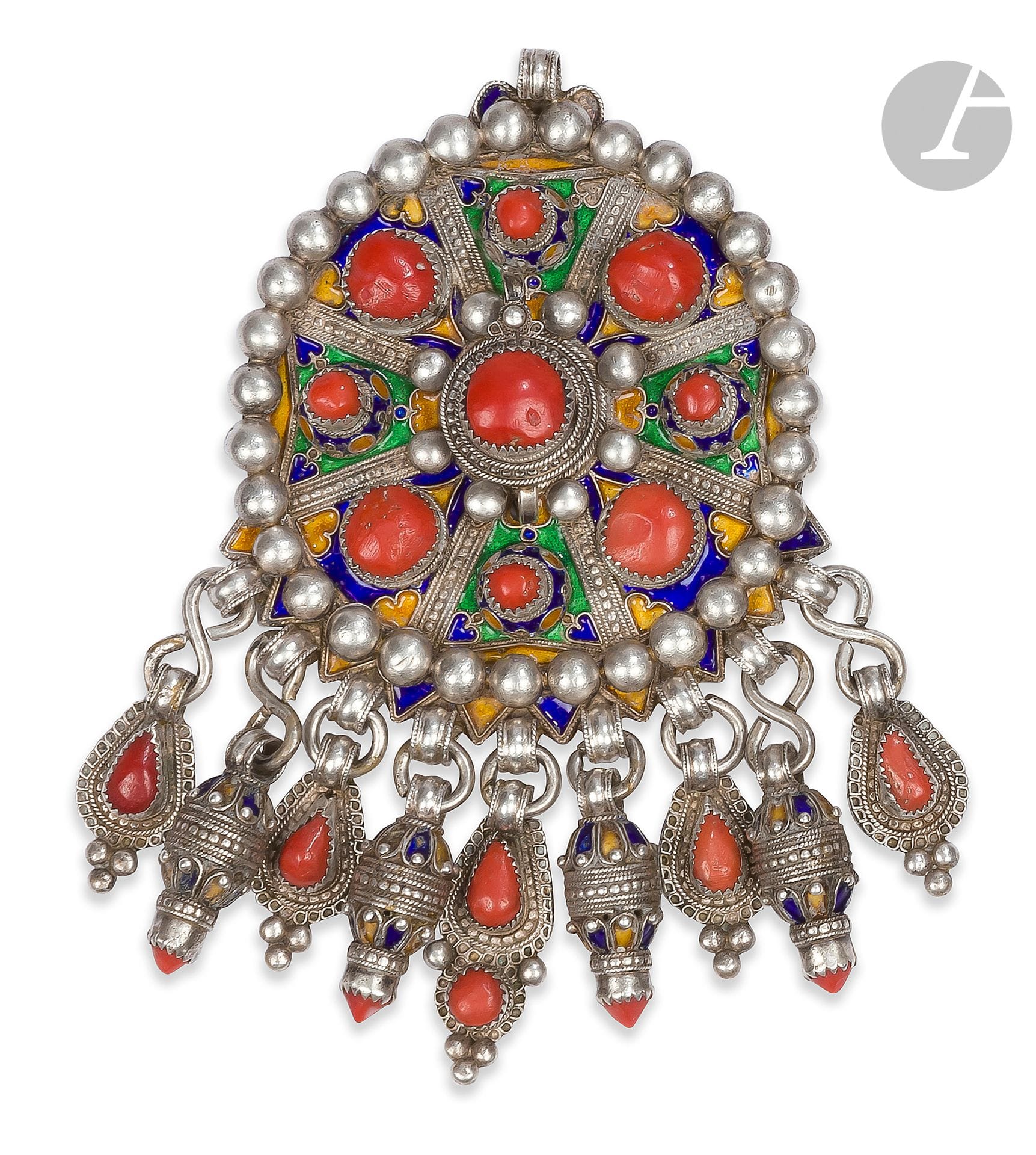 Tabzimt fibula, Algeria, Grande Kabylie, Beni Yenni, 20th century
Circular enameled silver fibula with coral cabochons, encircled by applied silver beads and highlighted with nine pendants.
Height: 16.3 cm, gross weight: 291 g
Missing barb, slight enamel chips, one pendant twisted.
