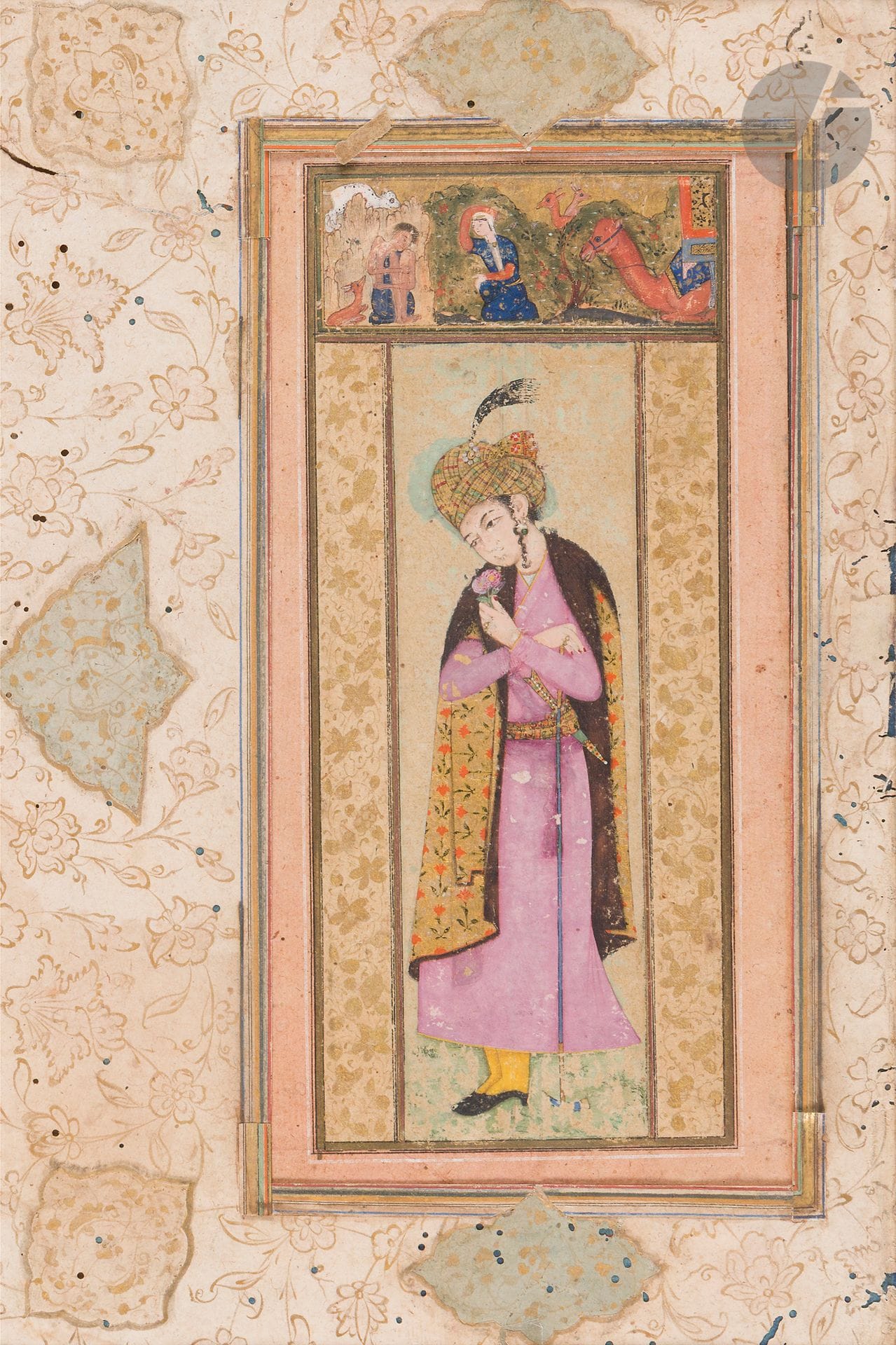 Man with a rose, Safavid Iran, 17th century
Gouache, ink and gold on paper depicting a standing man wearing a mauve robe tied with a sash woven with gold and polychrome threads, with a fur-lined cloak decorated with flowers on a gold background draped over his shoulders. He is wearing a turban with aigrette matching his belt, into which a dagger is tucked, and is holding a dervish's cane in his right hand, while his left hand holds a rose whose perfume he is inhaling. Mounted on an album page with two gilded floral borders and a gouache-painted upper cartouche depicting Leila's visit to Majnun. All around, gold-painted floral margins punctuated by medallions and cut-out poly-lobed cartouches on a pastel background.
Portrait size: 12.7 x 4 cm; page size: 21.9 x 14.4 cm
Discoloration, overpainting, wormholes in the damaged margin.