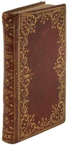 [BRUSSEL (Pierre)]
Suite du Virgile travesti. Livres Viii. iX. X. Xi. Xii. La Haye (Paris): s.n., 1767. - in-12, xij, 257 pp. Maroquin rouge, dentelle dorée aux petits fers en encadrement sur les plats, dos lisse orné, roulette dorée intérieure, doublures et gardes de papier semé d'étoiles dorées, tranches dorées (reliure de l'époque). édition originale de cette suite au Virgile travesti de Scarron, proposée par Pierre Brussel. Ce dernier était conseiller du roi, auditeur à la chambre des comptes; il mourut vers 1781. Bel exemplaire en reliure à dentelle de l'époque, bien conservée malgré une petite épidermure sur le second plat