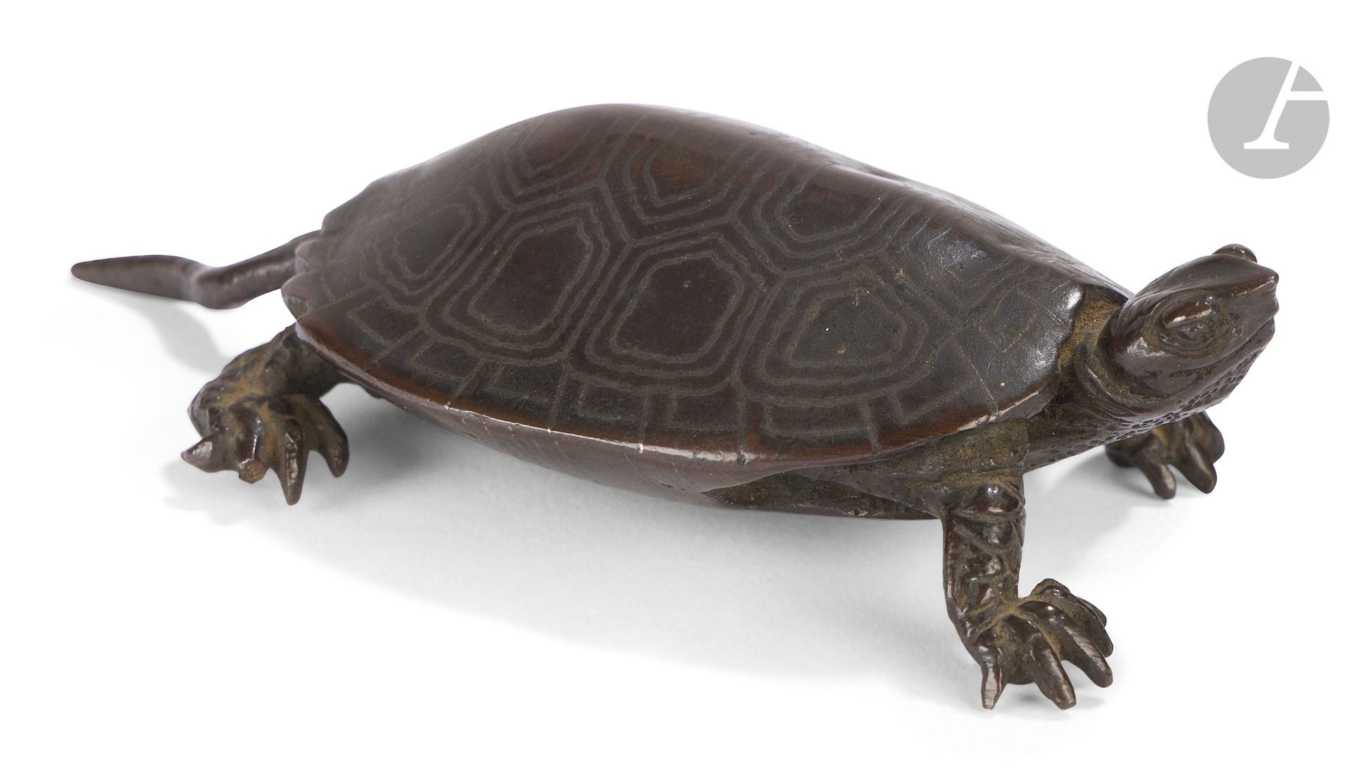 Brown patina bronze turtle, Japan, Meiji period (1868-1912)
Standing on four legs, head raised, shell and belly inlaid with silver and realistically treated.
10.6 x 6 cm