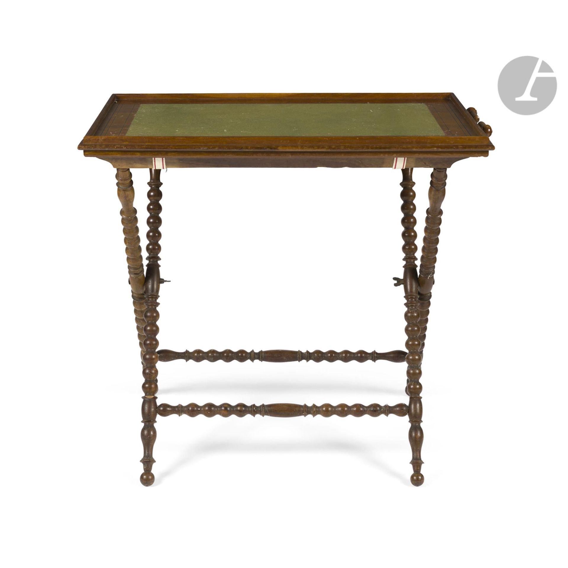 Turned walnut, burr wood and filleted wood tray on base, removable tray and folding base; (accidents; handle missing).
England, 19th century
H.: 76cm, W.: 81cm, D.: 51cm

Provenance: Château du Perthuis.