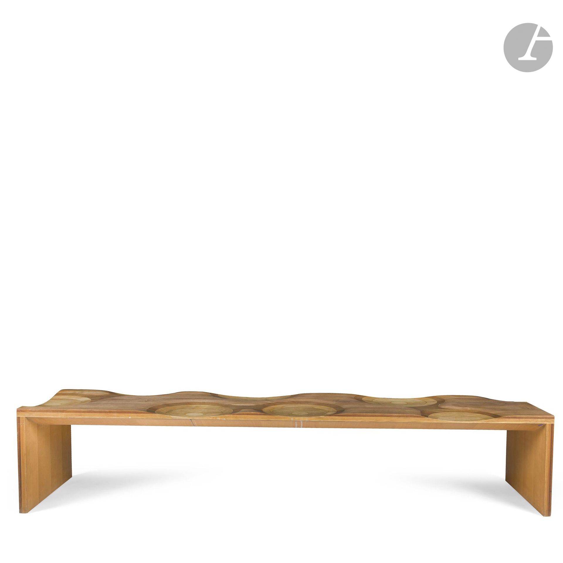 TOYO ITO (B. 1941) DESIGNER &amp; HORM CASAMANIA ITALY PUBLISHER 
Ripples, the model created in [2003] and awarded the Compas d'Or 2004 
Double-sided, upside-down U-shaped bench with recessed seat. Proof in canaletto walnut, mahogany, cherry, oak and ash. Used condition, stains. H.41 cm - W. 200 cm - D.50 cm