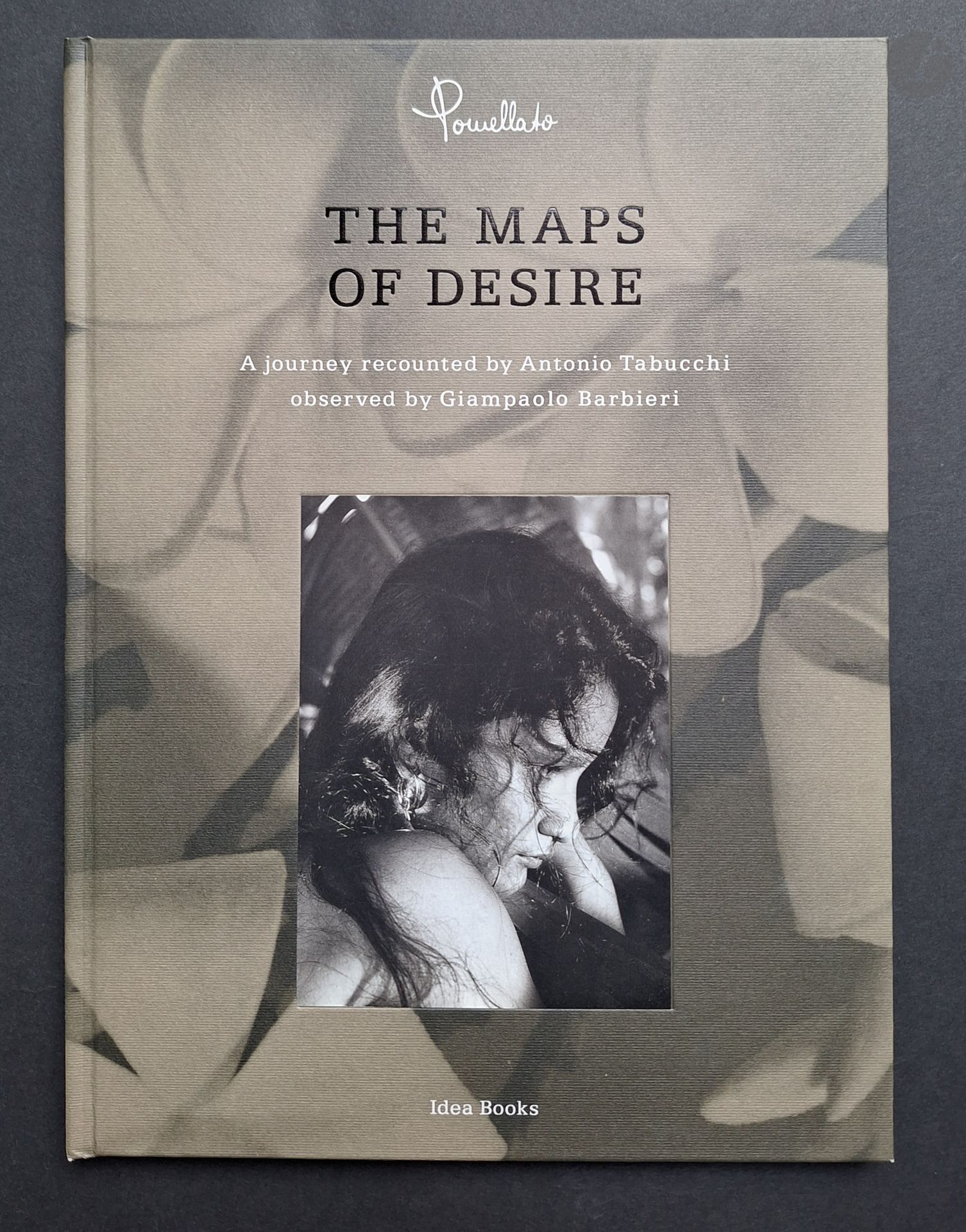 BARBIERI, GIAN PAOLO (1938) [Signed]
Pomellato. The Maps of Desire.
A journey recounted by Antonio Tabucchi, observed by Giampaolo Barbieri. 
Idea Books, Pomellato, Milano, 1989.
In-4 (30 x 22 cm). First edition, dedicated and signed by Gian Paolo Barbieri in 1989, accompanied by 17 original 18 x 24 cm prints, annotated on the spine. One leaf of text, in English. Housed in a titled Pomellato slipcase.