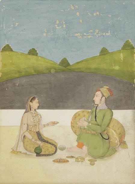 Prince et jeune femme sur la terrasse d?un pavillon, Inde moghole, fin du XVIIIe siècle Peinture sur page cartonnée, représentant un prince vêtu d?un manteau vert et coiffé d?un turban grenat et or assis contre un coussin, les jambes maintenues nouées par un yogapatta. Il s?entretient avec une jeune femme qui lui tend une petite coupe sur un plateau, tous deux étant assis sur la terrasse d?un pavillon. Dim.: 20,5 x 15 cm A prince and a young woman seated in a pavilion, Mughal India, late 18th century