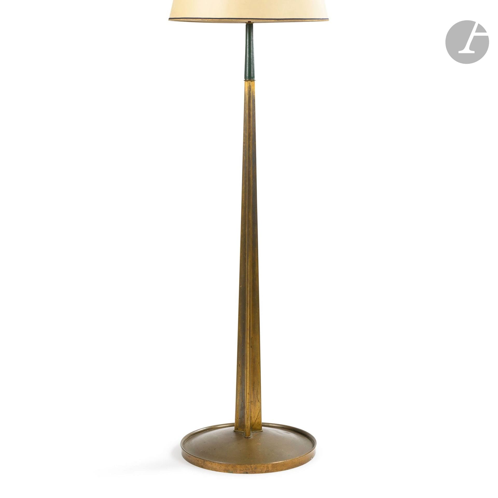 ALFRED PORTENEUVE (1896-1949) DECORATOR &amp; RAYMOND SUBES (1893-1870) WROUGHT-IRON CRAFTSMAN
Floor lamp in gilded brass.
The truncated Y-shaped shaft has three airplane wing profiles and is topped by a part sheathed in original green leather.
The circular, domed base, on a wooden core with an overhanging rim, in gilded brass.
Circa 1935.
Worn, missing and oxidized gilding, small dent on the base.
Height: 142cm - Base diameter: 45cm

Bibliography:
- Mobilier et Décoration - October 1936. An identical floor lamp can be seen in a photograph reproduced on page 377.
- Art et Industrie - June 1936. An identical floor lamp in a photograph reproduced on page 17.
- L'Architecture d'Aujourd'hui - June 1936 - An identical floor lamp can be seen in a photograph reproduced on page 71.