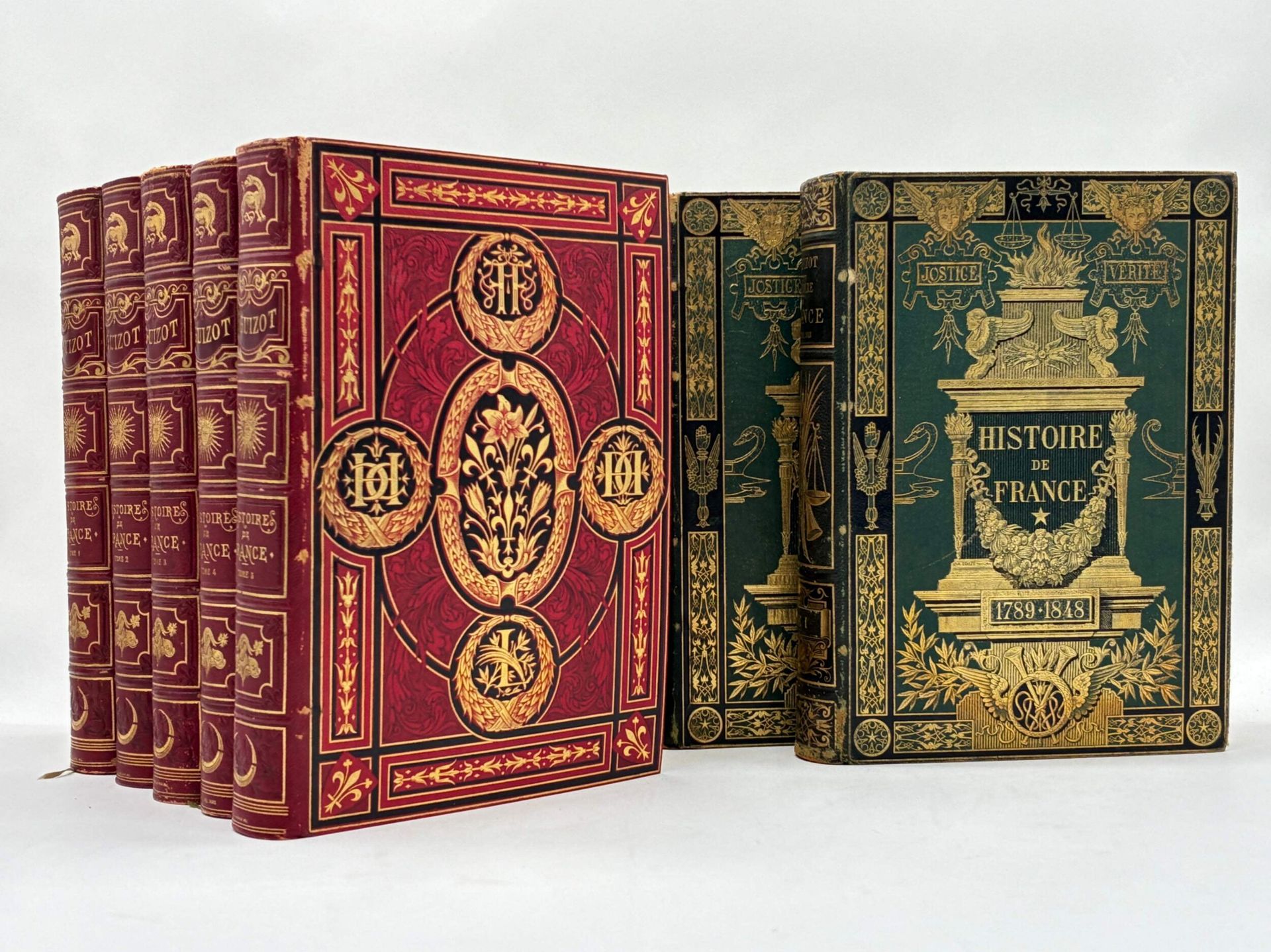 GUIZOT, François. L'histoire de France, depuis les temps les plus reculés jusqu'en 1789, racontée à mes petits-enfants. Followed by] Histoire de France depuis 1789 jusqu'en 1848 racontée à mes petits-enfants, leçons recueillies par Madame de Wit, née Guizot.
Published in Paris by Hachette et Cie between 1873 and 1879.
In 7 volumes, In-4 format. Red publisher's boards, rich gilt and cold decoration on boards and spine, all edges gilt, white silk lining and endpapers. Bindings signed by Engel.
578; 574; 564; 570; 598; 731; 789 pages, 7 woodcut frontispieces in serpents, numerous woodcuts in and out of text, including engraved title vignettes and several headpieces.
Rubbing with slight loss, covers damaged on one volume. Sporadic foxing.

First edition of this History of France, from the earliest times to 1789, told by François Guizot "to his grandchildren". The text is accompanied by abundant wood-engraved iconography by Alphonse de Neuville, P. Philippoteaux, E. Ronjat...
Complete collection in 7 volumes, including the two volumes published in 1878 and 1879, entitled "L'Histoire de France depuis 1789 jusqu'en 1848 racontée à mes petits-enfants, leçons recueillies par Madame de Wit, née Guizot", which complete the series. These last two volumes are bound in full green cardboard decorated with rich gilding, distinct from the first 5.

Superb decorative ensemble.