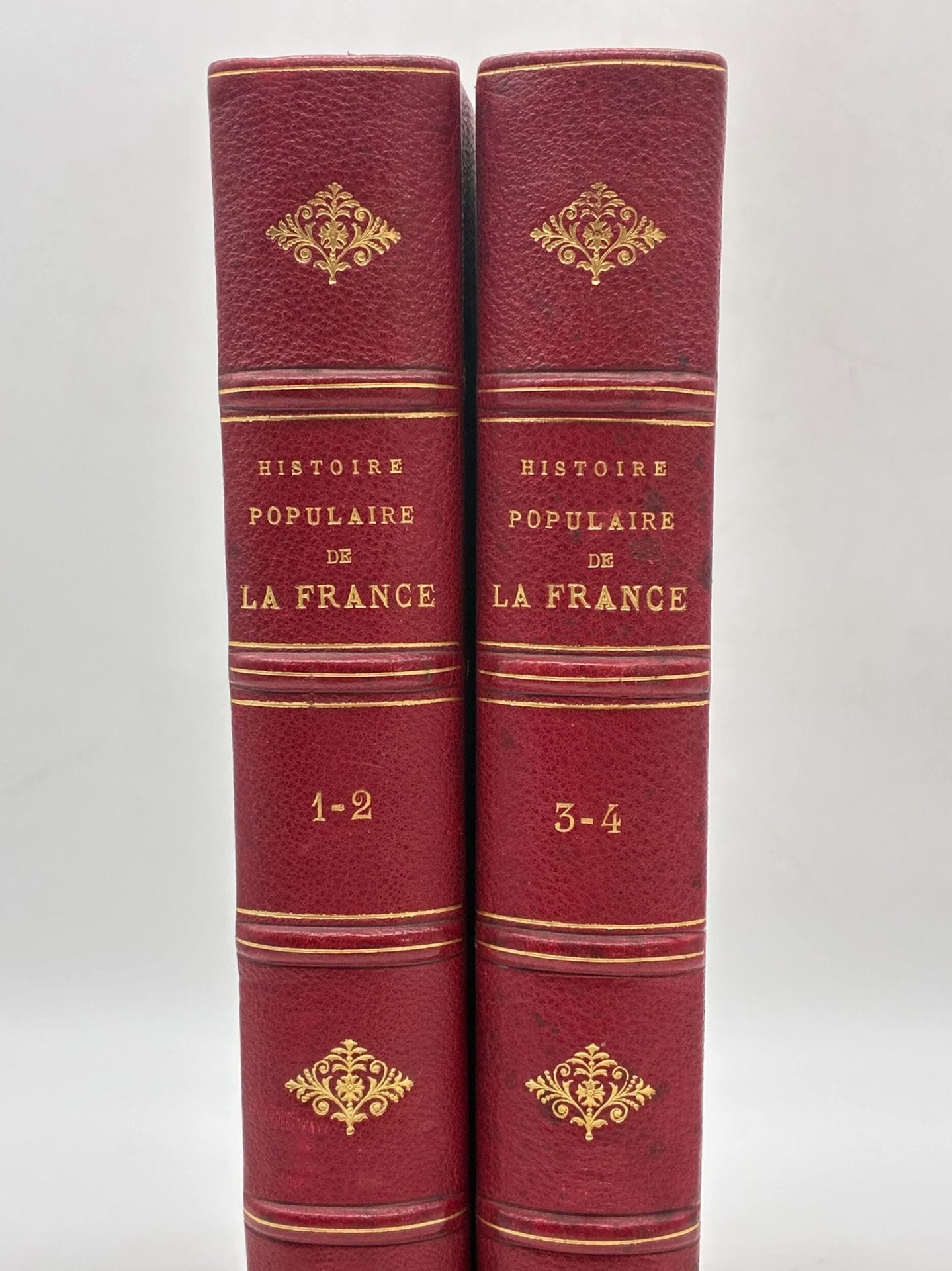 DURUY, Victor. Histoire populaire de la France.
Published in Pairs by Imprimerie générale and Lahure s.d.
4 volumes in 2, In-4 format. Red half-chagrin, spines with faux-nerfs outlined in gilt fillet and framed in cold, gilt fleurons, title in gold lettering, speckled edges, bookmarks preserved. Contemporary binding.
416-416; 432-428 pages, 1515 black engraved vignettes (360 vignettes in vol. 1, 345 in vol. 2, 345 in vol. 3, 364 in vol. 4). Printed on two columns. 
Some scuffing, corners worn. 

Victor Duruy's famous Histoire de France, in a two-column edition richly illustrated with 1,515 vignettes engraved by the finest artists (Émile Bayard, Gustave Roux, Édouard Riou, Henri Valentin, Georges Fath, Félix Philippoteaux, Évremond de Bérard, Bertall, etc.). 
A complete copy of the 4 volumes in 2 volumes. 

A fine homogeneous set from the period.