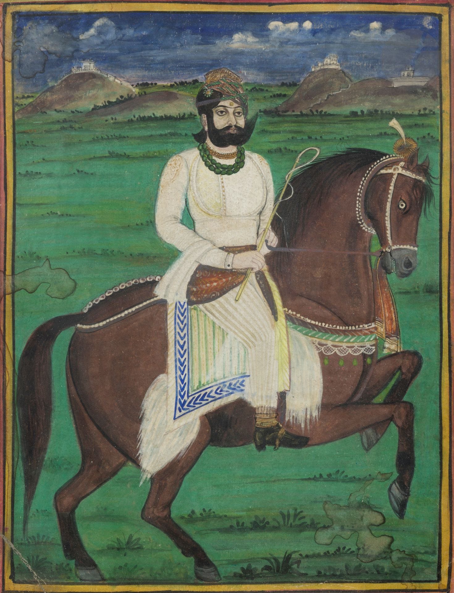 Deux portraits de Maharaja, peut-être le Maharana Swarup Singh d’Udaipur (r. 1842-61), Inde du nord, Rajasthan, début XXe siècle
Le premier, gouache et or sur papier représentant le raja, enturbanné et vêtu d’un jama blanc à dos d’un cheval à robe bai, cabré sur ses postérieurs, un paysage de collines en arrière-plan. Scène ceinturée d’une bordure jaune et d’une marge rouge. Le second, portrait en médaillon, aquarelle sur papier signée en bas à droite Om Prakash. Le maharaja en buste, richement paré et coiffé d’un turban orange à ornements perlés. Cadre.
30,6 x 24 cm et 22,5 x 18,4 cm
Usure, un coin plié, mouillures sur le premier portrait.

Om Prakash Sharma semble être l’artiste indien contemporain né en 1932 et basé à New Delhi.