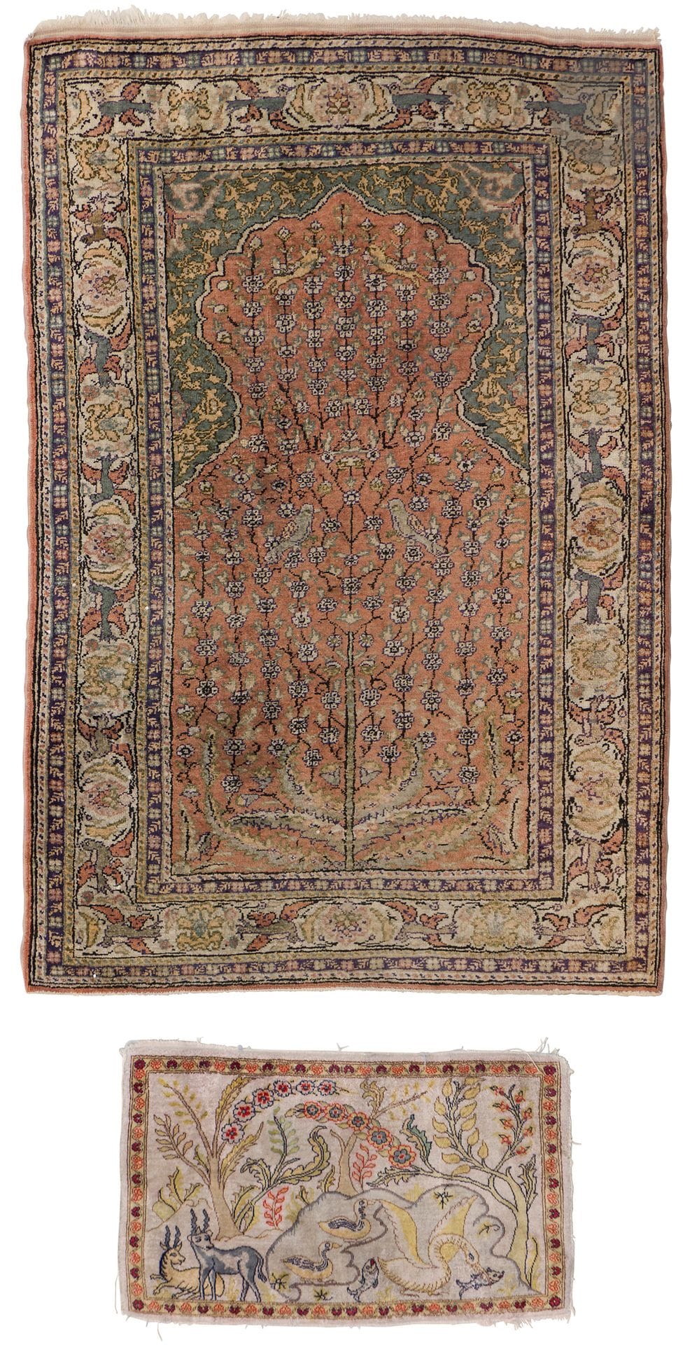 Kayseri silk carpet, Anatolia, Turkey, 20th century 
Knotted stitch, decorated with a tree of life in a mihrab prayer niche. 136 x 93 cm 
Slightly distressed, frayed, paint stains, wear. A small pictorial Persian carpet in Ghoum silk, Qom province, northern Persia, Iran, 20th century, is attached. 
Knotted stitch, decorated with a forest pond populated by various animals. 65 x 40 cm. Frayed, edges damaged, wear, red drips.