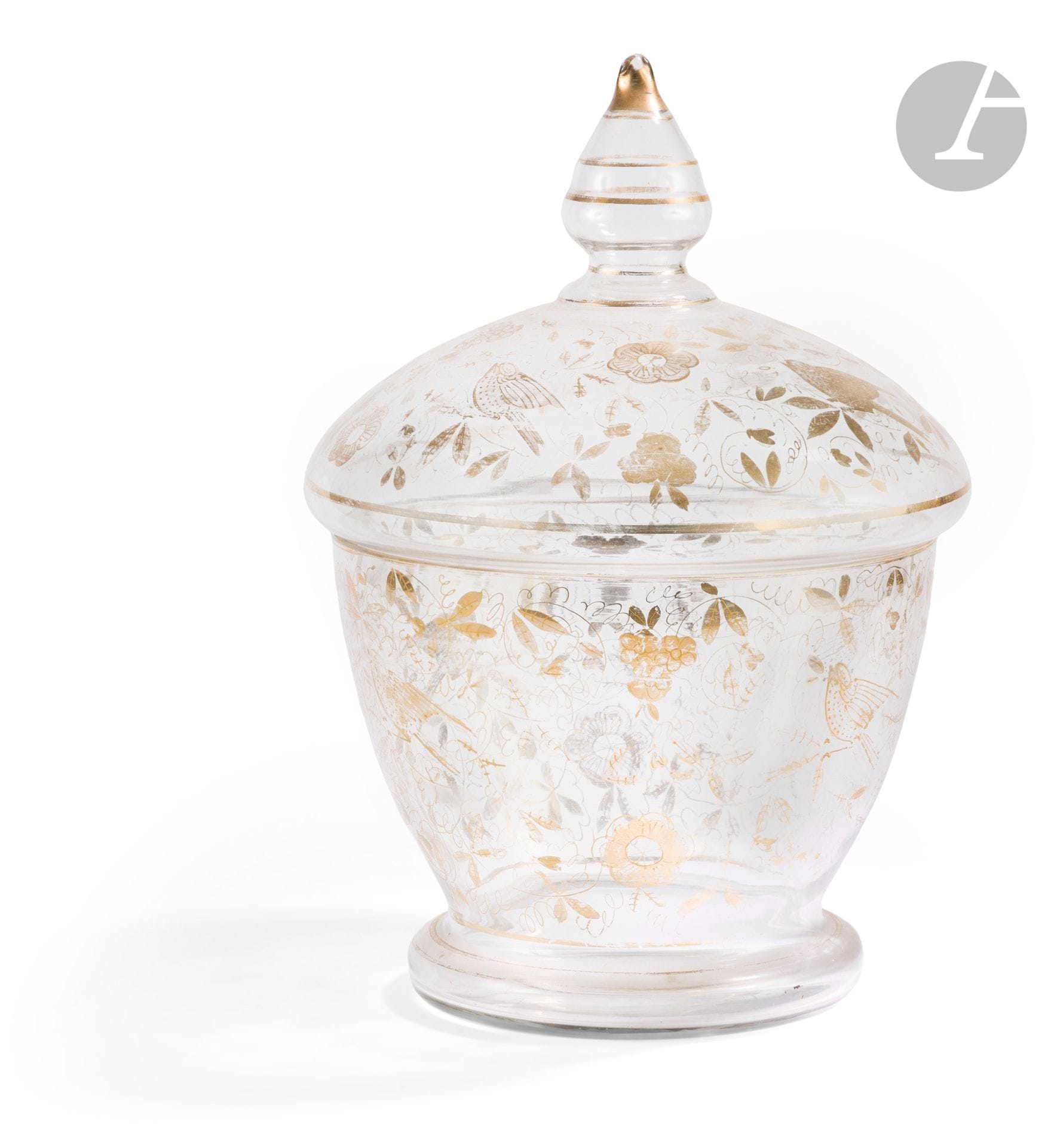 Large glass bonbonnière, Ottoman Turkey, Beykoz, 19th century
Container with ringed base, large hemispherical body and domed lid with conical grip, in translucent glass with gold-painted decoration of birds in flowering branches.
Height: 35 cm
Small chips at the base of the lid, gold highlights, small scratches on the base.