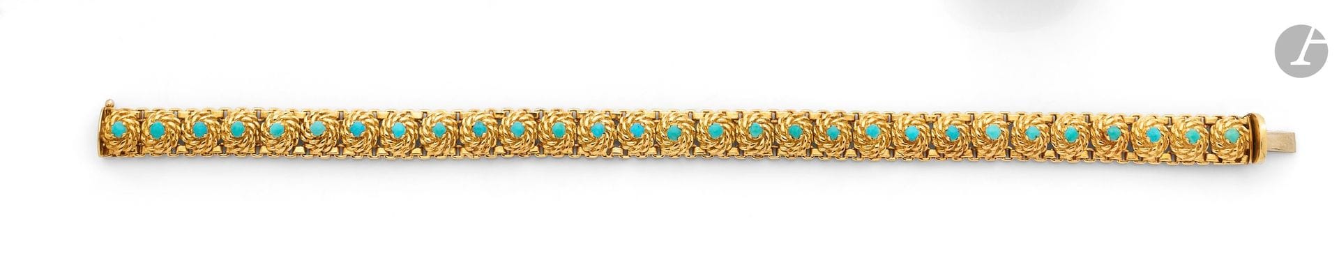 Bracelet articulé en or 18K (750), orné de turquoises cabochons. Travail des années 1960. Dimensions: 18x0,7cm environ. Poids brut: 26,9g