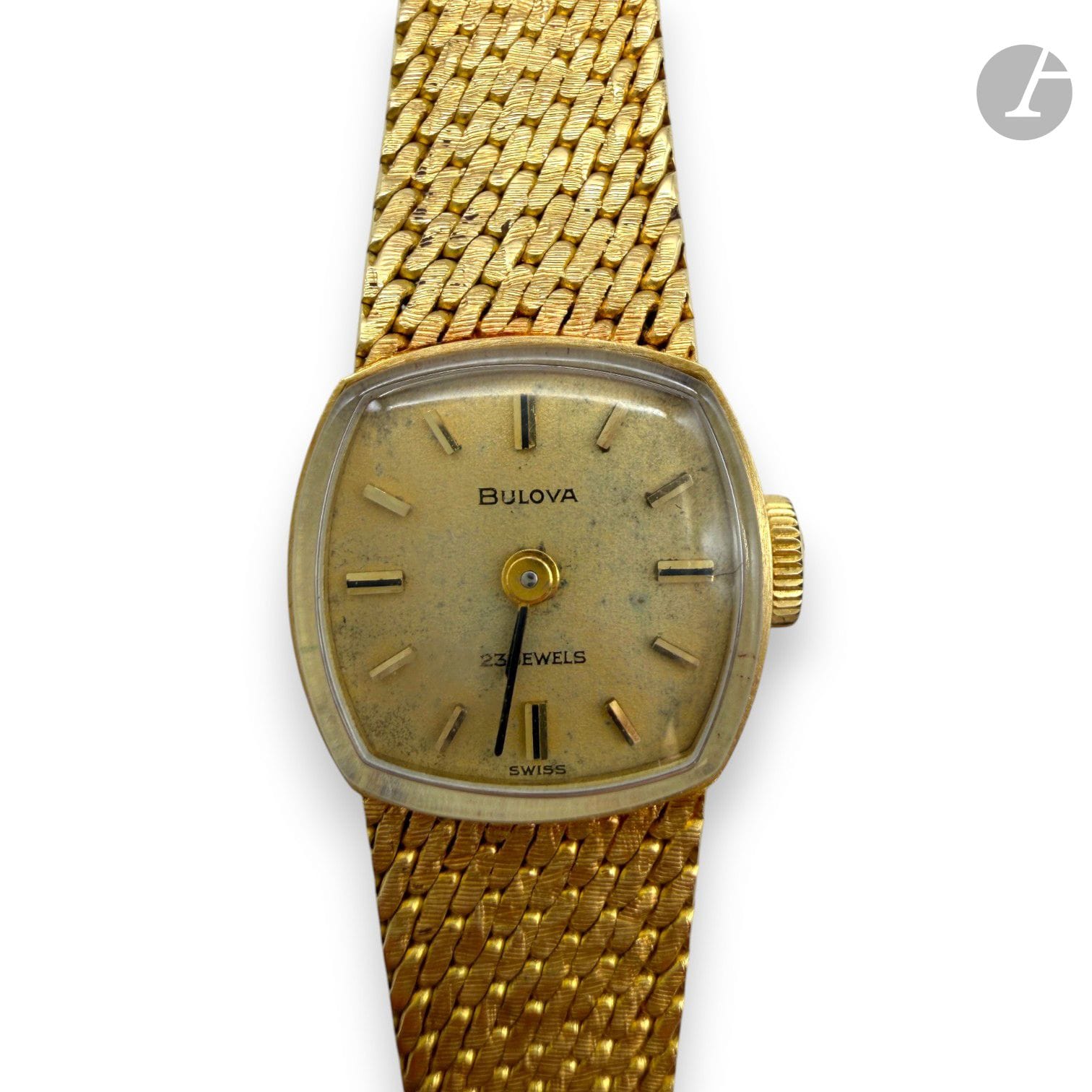BULOVA
Montre bracelet de dame en or 750/°°°, bracelet souple en or tressé.
Numérotée 449112 sur le boîtier.
Mouvement 17 rubis. 
Marque sur le cadran et le mouvement. 
Poids brut : 25,2 g

FRAIS DE VENTE : 8% HT