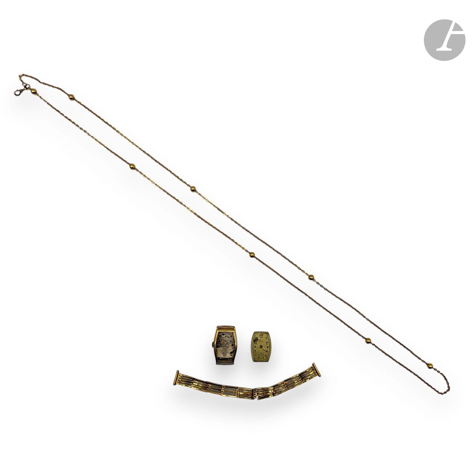 Lot in gold 750/°°° including : 
- A watch chain that can form a necklace with a gold bead motif. 
Net weight: 15.2g
- A dismantled wristwatch (bracelet accident).
Gross weight: 25.8g

SALES CHARGE: 8% EXCL.