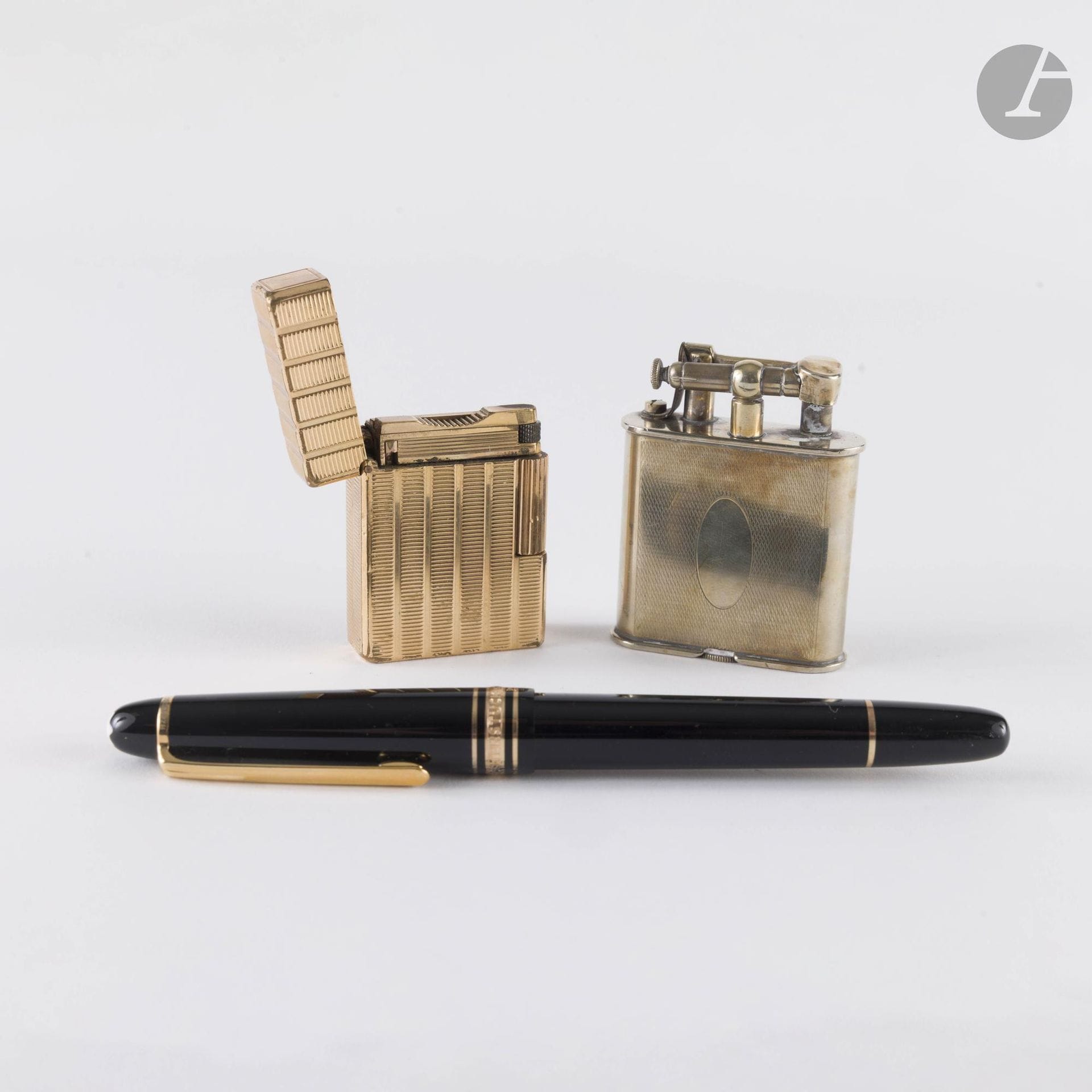 Two gilded metal lighters, one DUPONT the other ALPACA. A MONTBLANC pen is included.