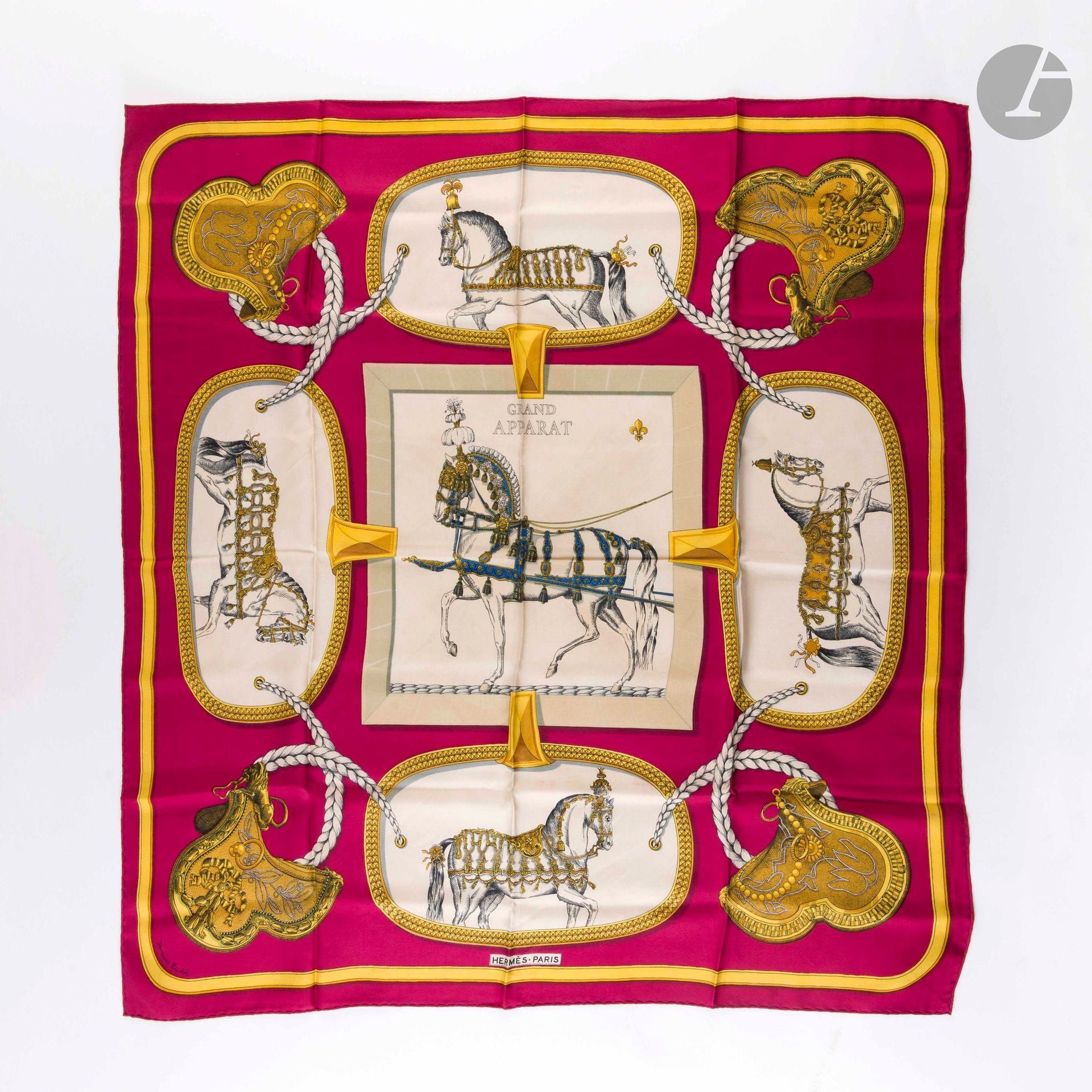 HERMÈS PARIS
Carré 90 in silk twill "Grand Apparât", signed Jacques Eudel, pink-red background
(traces of discoloration and soiling)