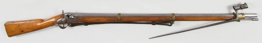 Allemagne
(BAVIÈRE) Fusil d?infanterie bavarois à silex transformé à percussion genre 1842. Canon rond à pans au tonnerre. Platine à corps plat et chien à arête médiane. Garnitures en laiton. Crosse en noyer verni, à joue. Baguette en fer. Avec une baïonnette à douille du type An IX français. B.E. Longueur arme: 142 cm Longueur baïonnette: 56 cm