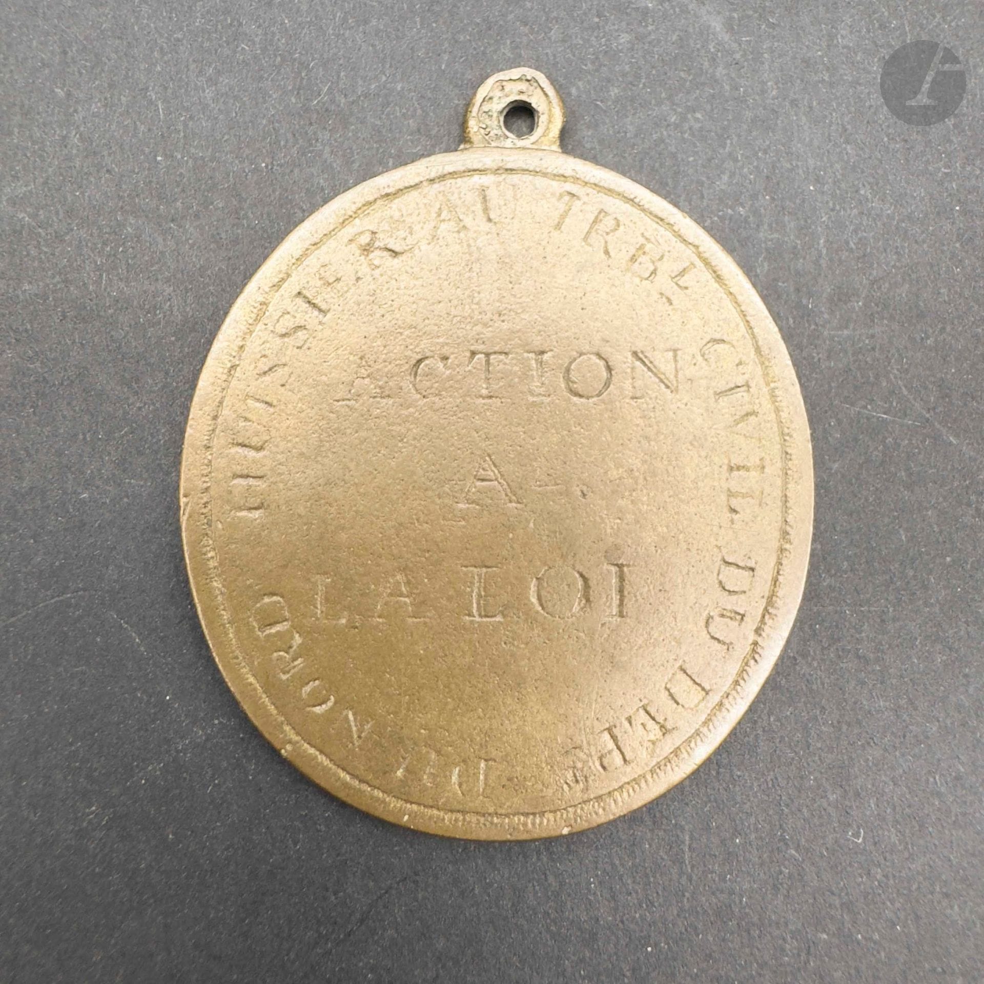 FRANCE 
Médaille d'huissier au tribunal civil du département du Nord. 
Brass, engraved on the obverse with the Phrygian bonnet on a pike, within a wreath of oak leaves and "liberte egalite". 
43 x 35 mm 
A.B.E. (Inscriptions partly faded).