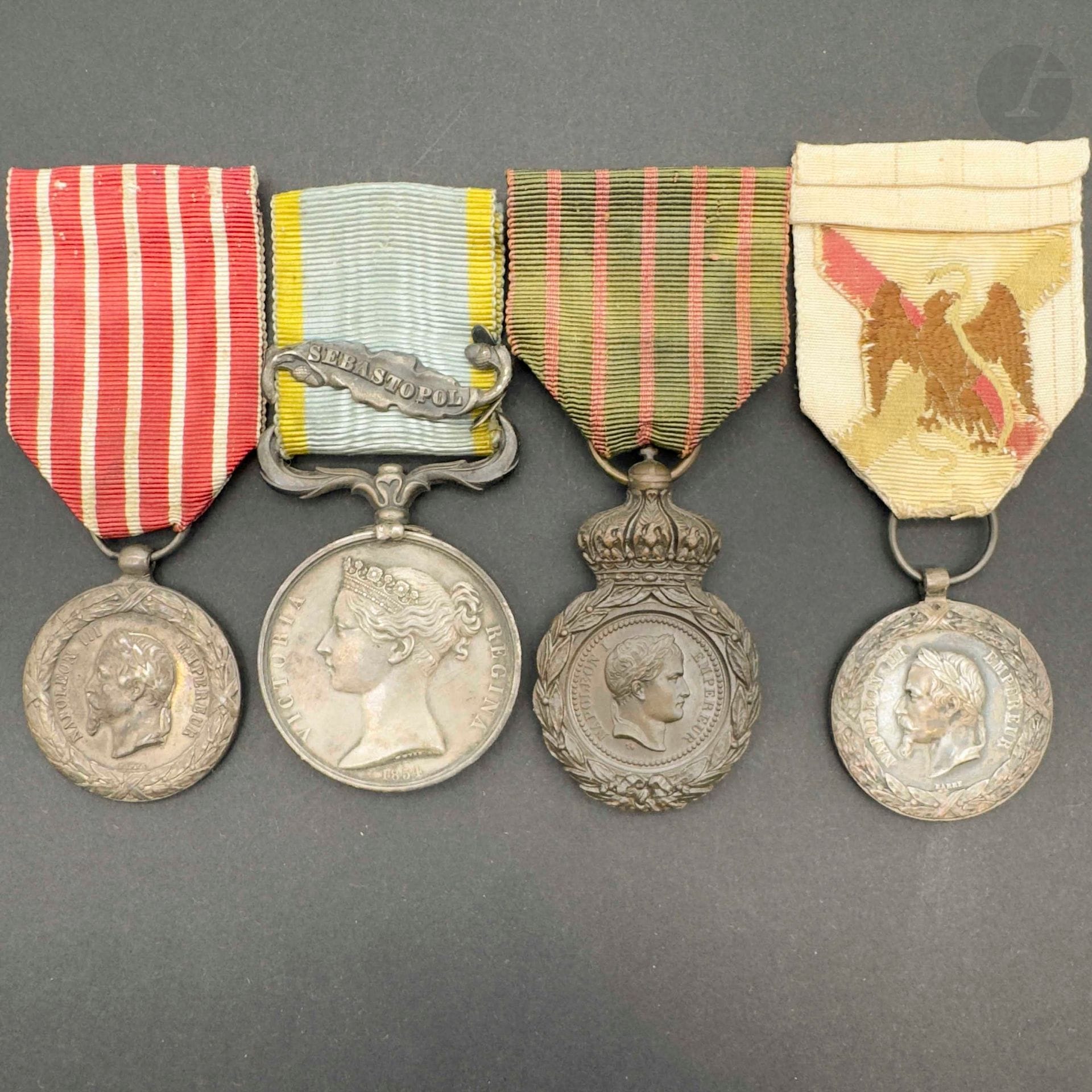 FRANCE 
Four medals: 
- Saint Helena medal. In patinated bronze. Ribbon. 
- Crimea medal. In silver. Ribbon with English "SEBASTOPOL" clasp. 
- Italian Campaign medal by Barre. Silver. Ribbon. 
- Campagne du Mexique medal, by Barre. Silver. Ribbon worn and restored. 
Presented framed.