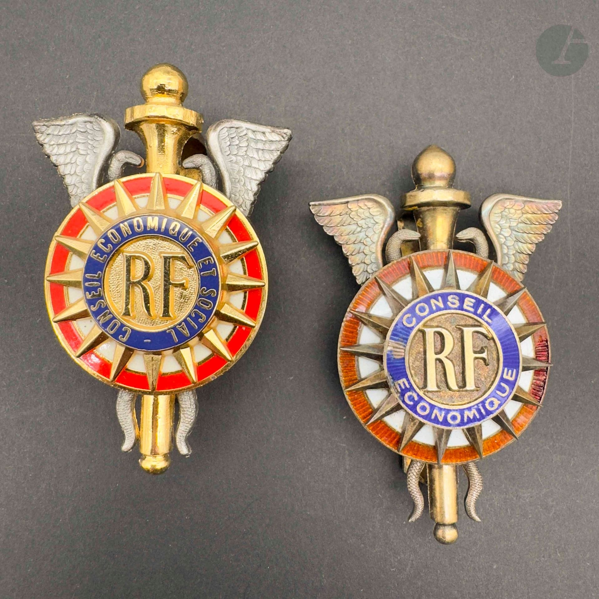 FRANCE
ECONOMIC AND SOCIAL COUNCIL 
Two badges: 
- conseil économique (1946-1958) in silver vermeil and enamel (chips). Paris mint and L. Bazor hallmarks. 
65 x 43 mm - Weight: 34 g
- economic and social council in gilt metal, silver and enamel. 
63 x 38 mm
T.B. and SUP.