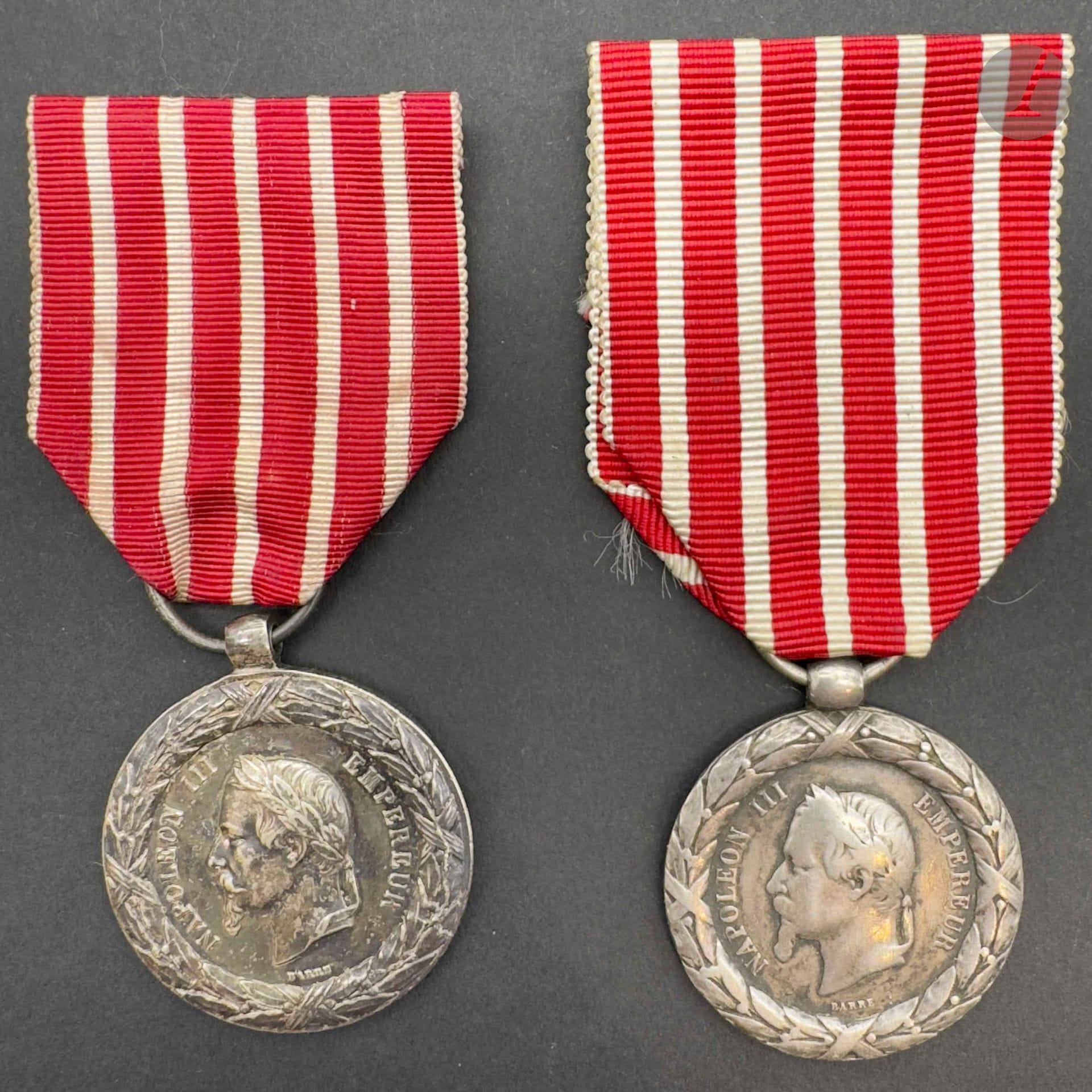 FRANCE 
ITALIAN CAMPAIGN MEDAL (1859)
Two Italian Campaign medals, 2nd type, by Barre. In silver. 
- one with crown in high relief. Wear to obverse. Olive hoop. Posterior ribbon. 28 mm 
- tube setting - Antique ribbon. 30 mm
Not punched.
T.T.B.
