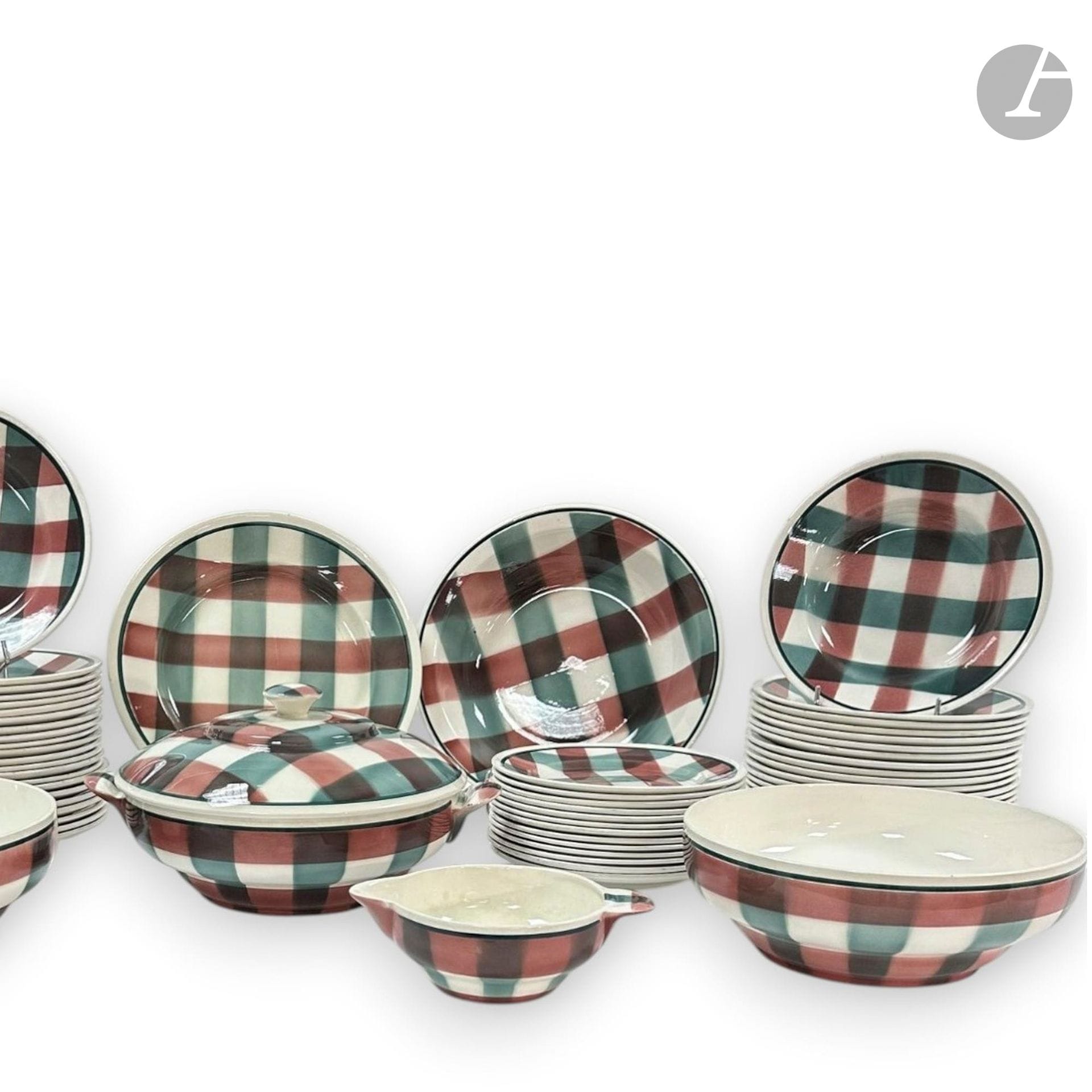 FAÏENCERIE NOUVELLE À GIVORS
Earthenware service with green and pink squared decoration on a white background, composed of :
- 2 shallow dishes, 
- 1 covered dish with side handles, 
- 2 circular serving dishes, 
- 1 sauceboat, 
- 22 plates,
- 17 soup plates, 
- 13 small plates,
Stamp under the base.
Chips, used condition.
D. 20 to 27 cm

Special collection conditions: Lots to be collected after the sale on Monday June 15 and Tuesday June 16 at Saint-Ouen.