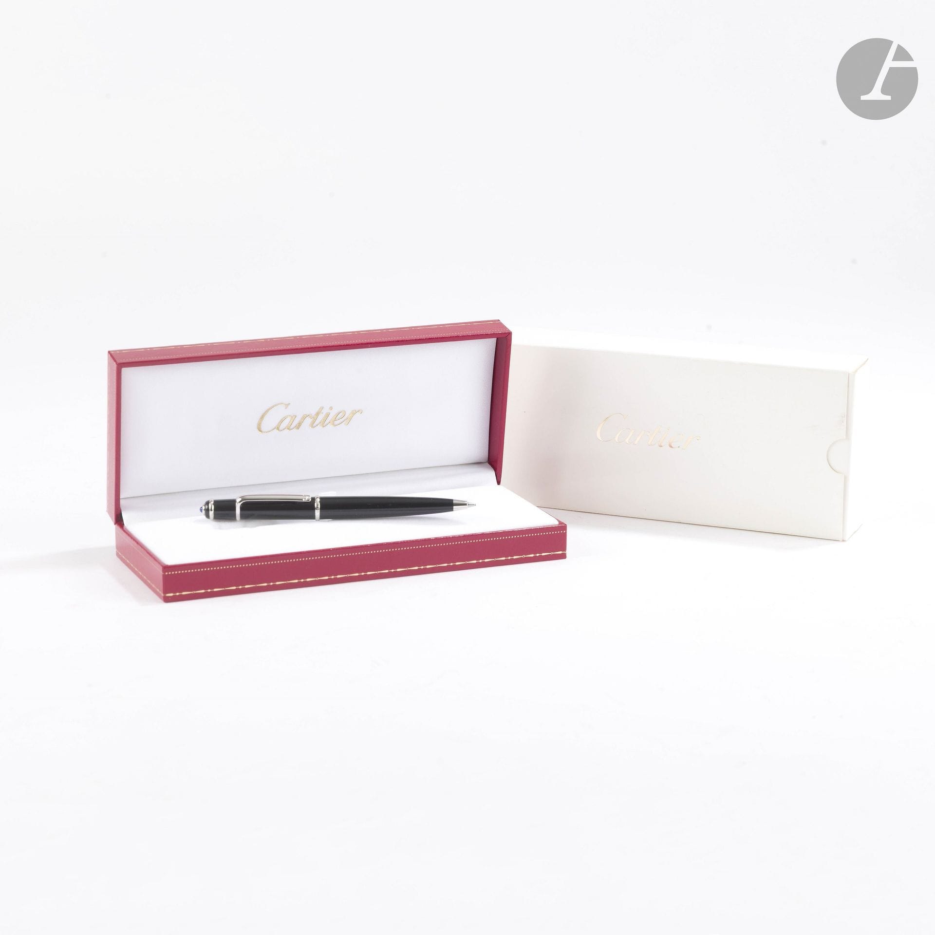 CARTIER
Mini ballpoint pen from the DIABOLO line, made of black resin and Silver plated metal. In its box
L: 11.2 cm