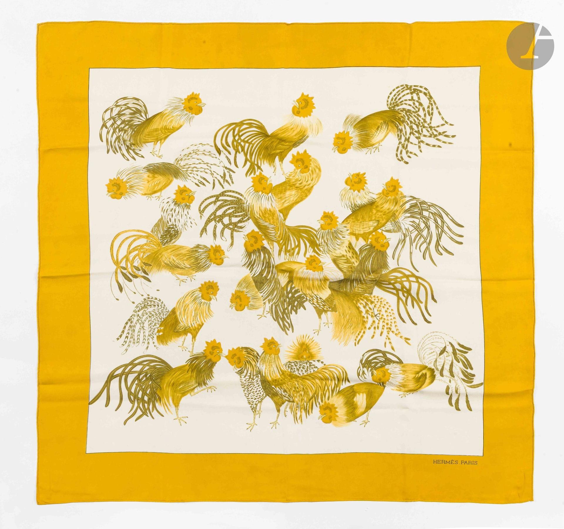 HERMÈS PARIS
Carré 90 in “Les Coqs” silk twill, with a white background and yellow border. Based on a design by Gabriella La Torre
(some marks and a few loose threads)

See variations in lots 29 through 38

Provenance:
Collection of the artist’s family. Assembled under the direction of Fabrizio La Torre, son of Gabriella La Torre, this collection reflects a desire to recreate a body of work that brings together the artist’s archives and pieces produced by Hermès.

Gabriella La Torre (Rome, 1894–1976) was a porcelain painter. Over several decades, she developed a distinctive body of work inspired in particular by her passion for the decorative arts and antique porcelain, whose designs she studied and collected.

Beginning in 1957, she collaborated with Hermès, for which she created numerous designs that gave rise to silk scarves, ready-to-wear pieces, and porcelain objects. Her creative vision gave rise to patterns such as “Insects,” “Flowers and Braids,” “Oranges and Lemons,” “Cherries,” “Roosters,” and “Old China.”