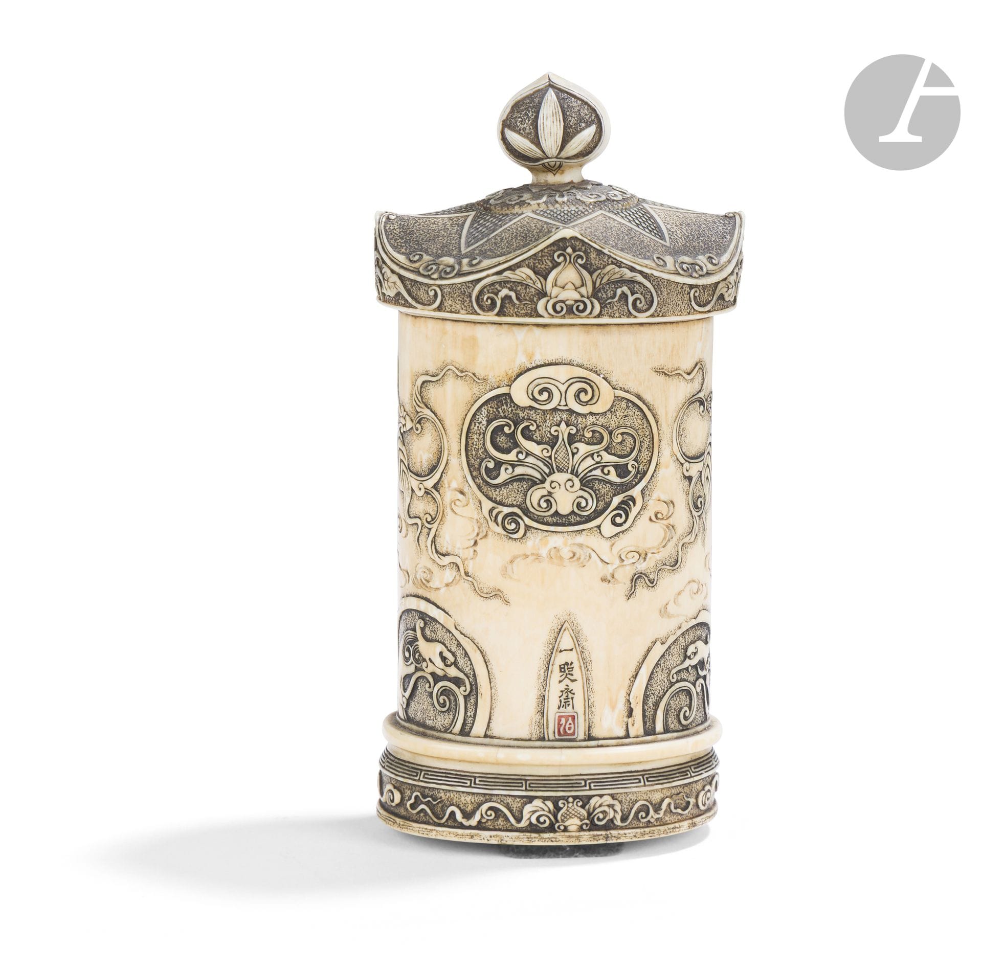 Small ivory zushi, Japan, Meiji period (1868–1912)
It is carved in high relief with an ama ryu motif and foliage. The interior of the doors is engraved with a design of lotus flowers and leaves. The bodhisattva that originally sat inside the zushi is missing. A signature is engraved on the back: Isshosai - 㷖(照)斎.
Height: 12.5 cm; weight: 170 g