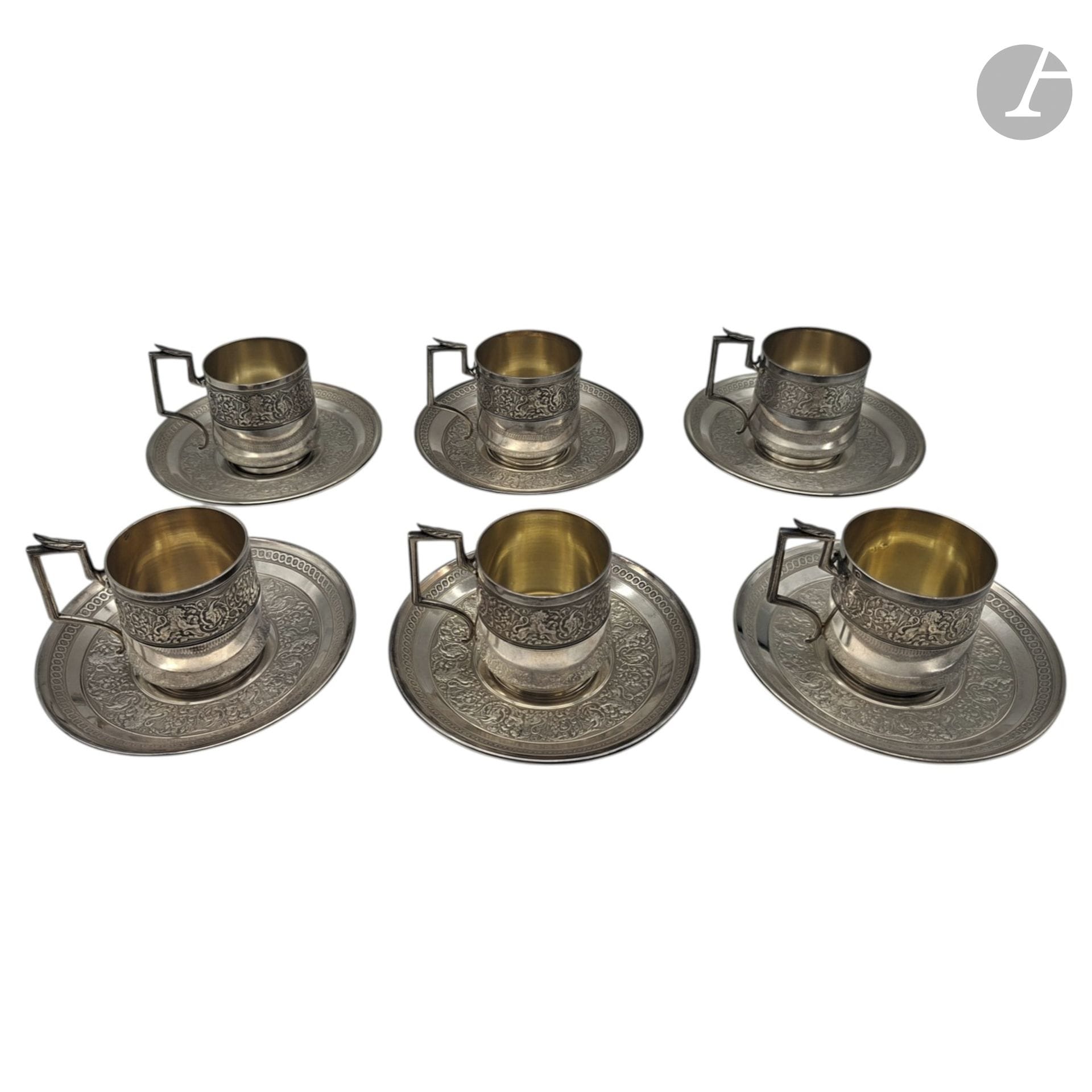 TALLOIS AND MAYENCE
Set of six 950°/°° silver cups and saucers decorated with lion friezes. 
Net weight: 1179 g

BUYER'S FEES: 20% (including tax)