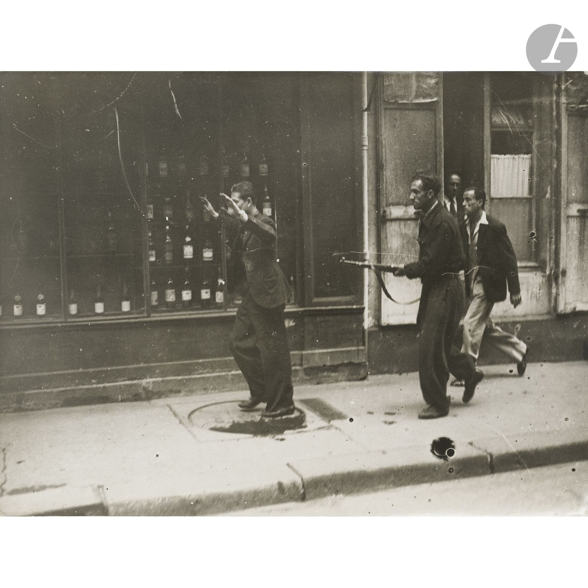 Press photographer
World War II. Liberation of Paris, August 1944.
The French Forces of the Interior (FFI) with a militiaman.
Vintage silver print. “Photo-Presse-Libération” stamp on the reverse.
18.3 x 24 cm