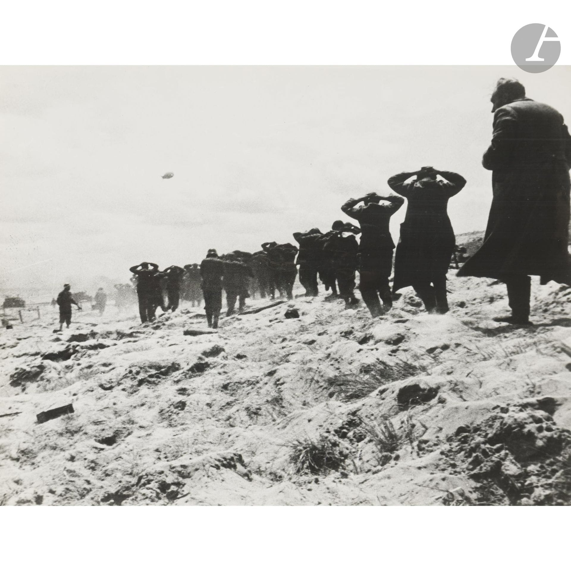 U.S. Army Signal Corps Photograph
World War II, 1939–1945.
A line of German prisoners on the dunes of Utah Beach, June 6, 1944.
Vintage silver gelatin print. Typewritten caption on a label on the reverse.
Image: 27 x 34 cm - Sheet: 28.5 x 35.5 cm