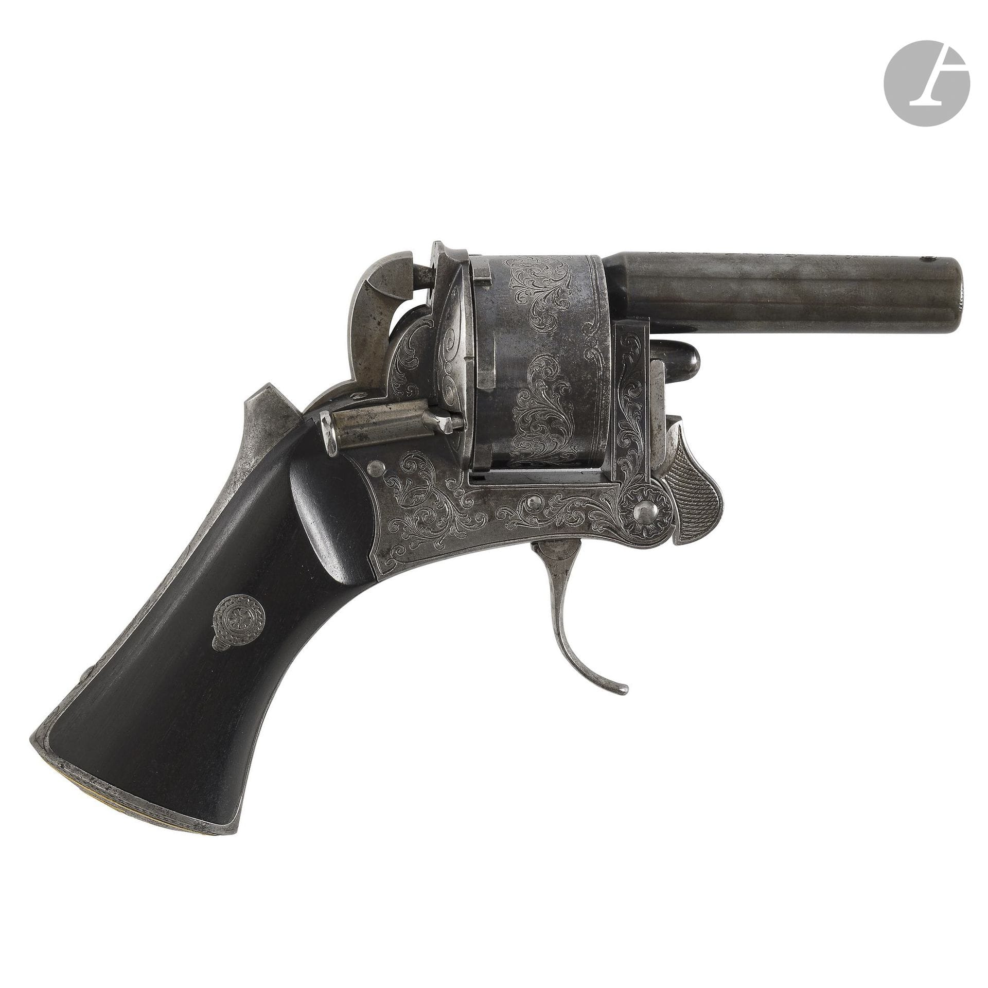 Small Fauré Le Page pocket revolver, made in Paris; six-shot, approximately 8 mm caliber, double-action.
Round, rifled barrel, engraved on top with “Fauré Le Page à Paris.” Cylinder and frame engraved with foliage scrollwork. Hammer without a crest. Varnished walnut grip plates. Pommel inlaid with the gold initials “PEB.”
Barrel length: 5.7 cm 
Overall length: 14 cm
Date of manufacture: circa 1880.