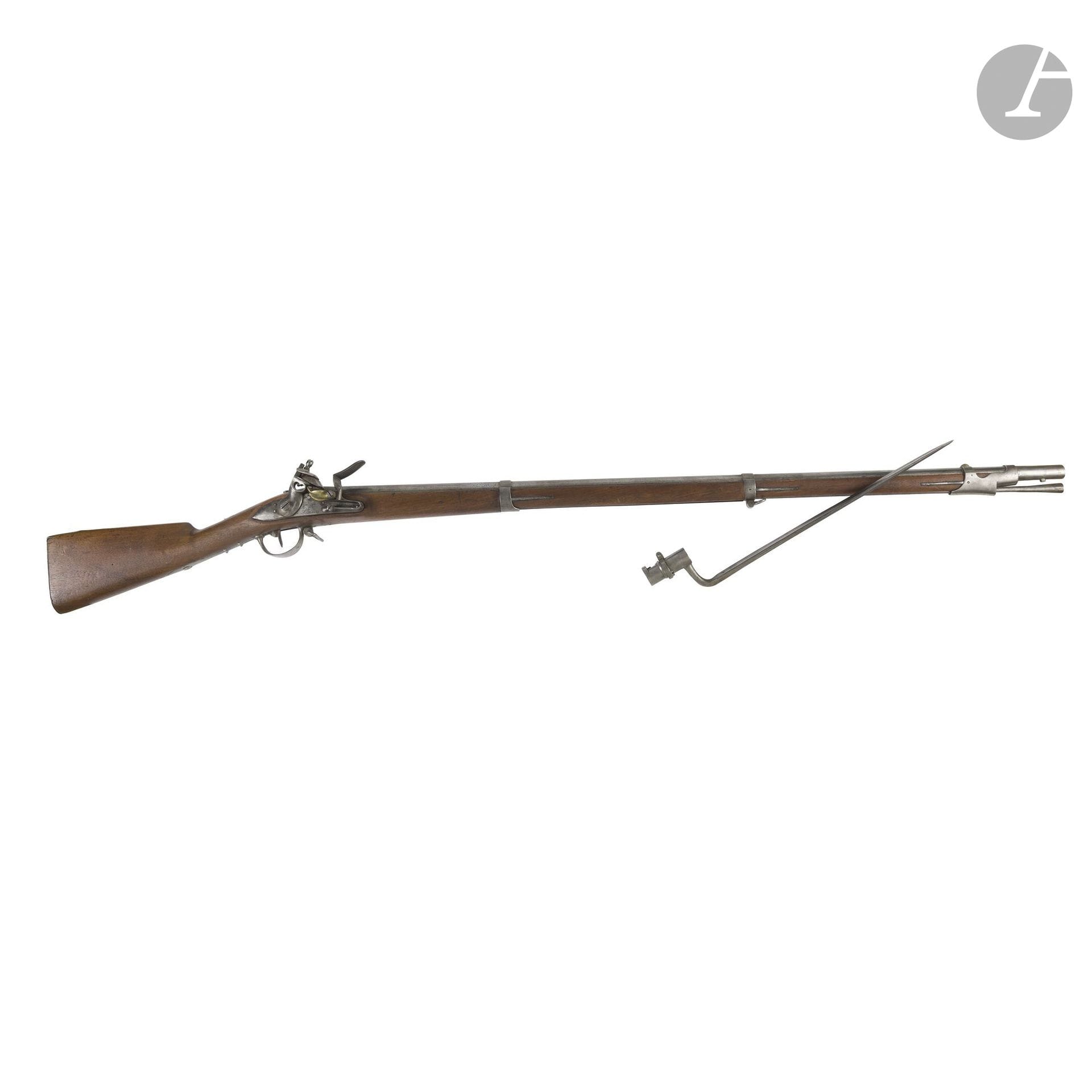 Model 1822 flintlock infantry musket.
Round, faceted barrel with serial number and hallmarks. Breech block stamped “Mle 1822.” Lock marked “Mre Rle de St Etienne” with a round-bodied hammer. Stamped brass lock plate. Stamped iron fittings. Butt plate with two holes. Walnut stock bearing the barrel’s serial number. Iron ramrod.
Barrel length: 107 cm - Overall length: 147 cm
With a bayonet featuring a central ferrule.
Length: 47.5 cm A.B.E.