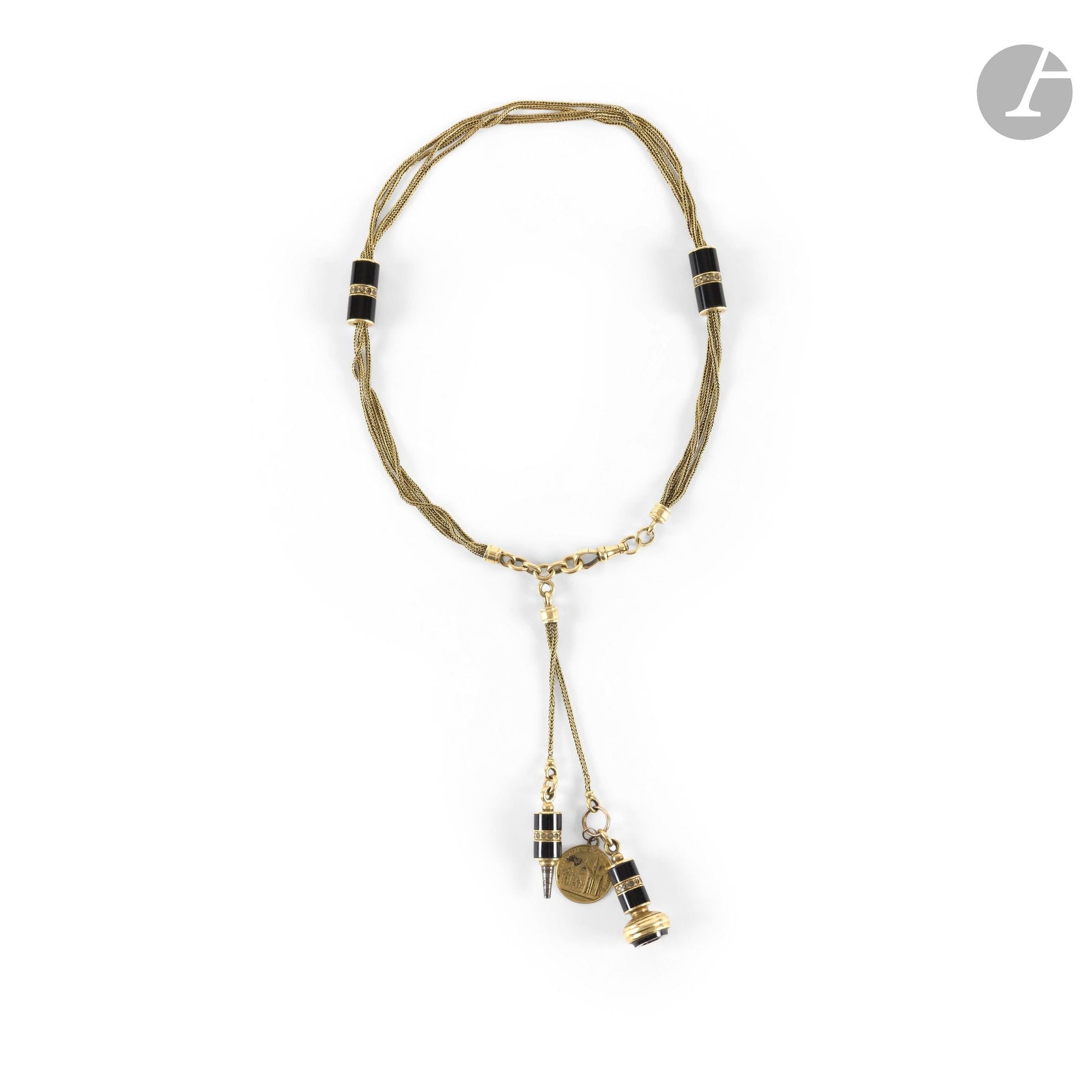 An 18K (750) gold chain holding a seal, a mechanical pencil, and black enamel pendants. Length: approximately 45 cm. Gross weight: 42 g (deformities, imperfections)