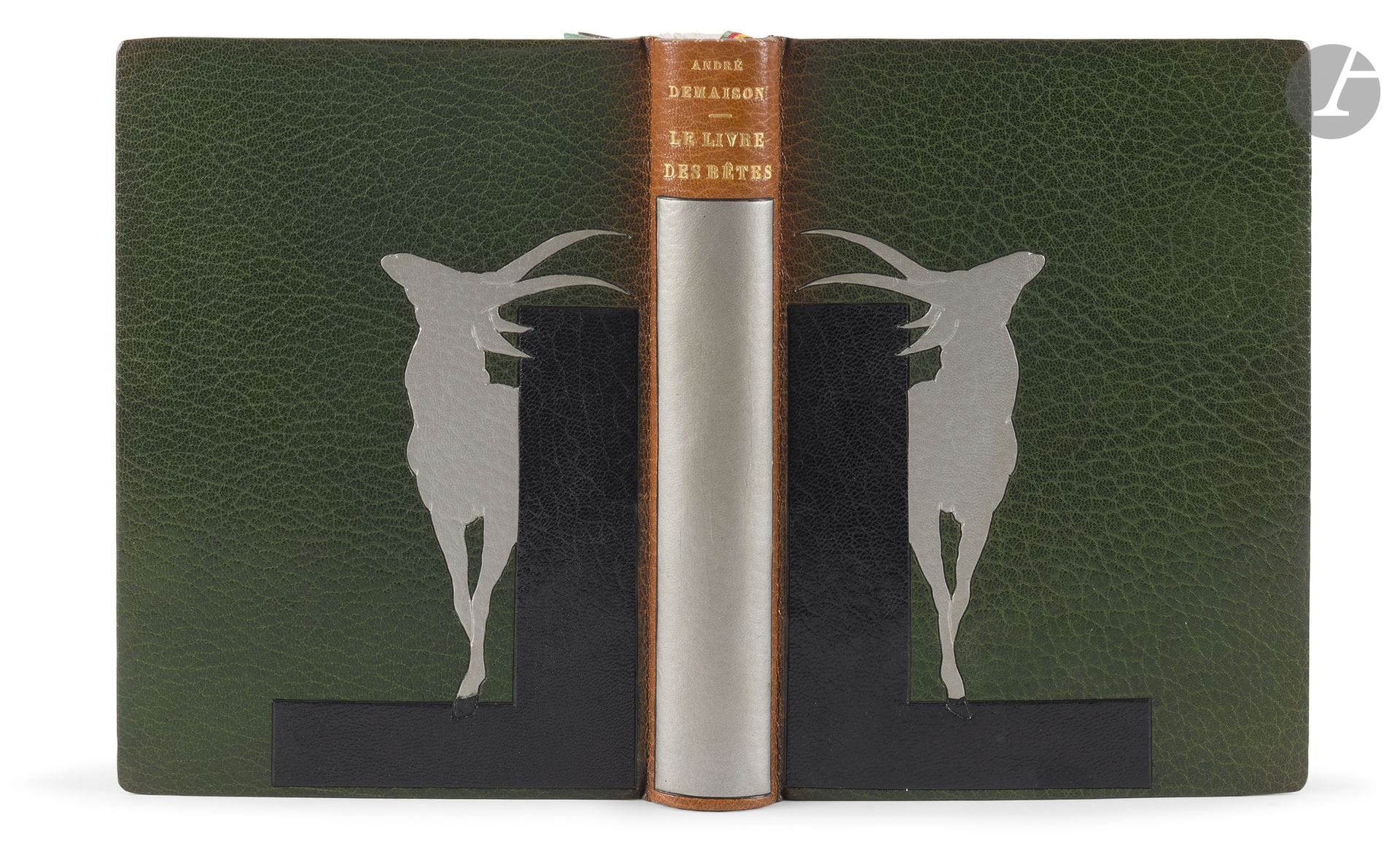 DEMAISON (André) - GUYOT (Georges Lucien).
The Book of Beasts Called Wild.
Paris: Librairie de la Revue française, [1930]. — In-8, 197 x 142: frontispiece, (6 leaves, first 3 blank), 204 pp., (6 leaves, last 3 blank), 10 plates, printed cover. Dark green morocco leather, covers decorated with a symmetrical composition depicting a silver antelope within a black morocco leather square, symbolizing a pair of bookends; plain spine adorned with a wide, long band in palladium, dark green morocco leather framing the interior, adorned with four pieces of dark gray morocco leather at the corners, joined together by three gilded fillets, green moiré silk endpapers and linings, double endpapers, gilt head, untrimmed, cover and spine preserved, slipcase (J. Van West).
Deluxe edition, the first illustrated edition, adorned with 11 original, out-of-text etchings by the animal painter and sculptor Georges Lucien GUYOT (1885–1973).
One of the first 10 copies printed on Imperial Japanese paper (no. 6).
A precious, unique copy, enriched with 17 original watercolor drawings by Guyot, as noted by the artist on the title page: “Adorned with eleven etchings by Guyot and seventeen watercolor drawings. Guyot 1932.”
Beautiful mosaic binding by the Belgian bookbinder Jules-Karl Van West.
Spine faded.