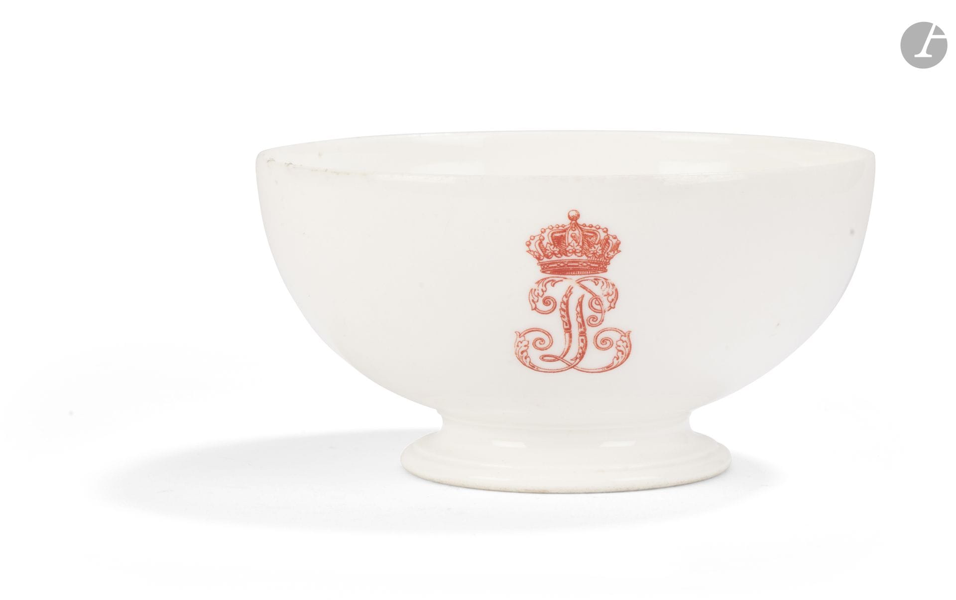 Sèvres
Porcelain bowl decorated in red with the monogram of King Louis-Philippe: interlaced “LP.” 
Marked: “LP” with crowns, “Sèvres” in blue, and the seal of the Château de Saint-Cloud in red.
19th century, Louis-Philippe period.
H.: 7.5 cm, D.: 14 cm