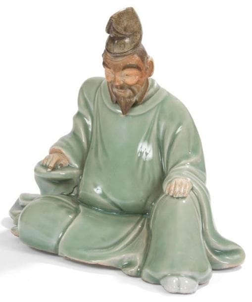 JAPON - Epoque MEIJI (1868 - 1912)
Groupe en porcelaine émaillée céladon, poète assis. Les chairs réservées en biscuit. H.: 20 cm