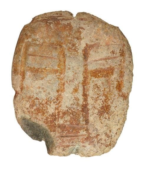 Tête stylisée. Pierre verte. Culture du Guerrero, Mexique 350 - 100 av. J.-C. H: 17,5 cm - l: 14 cm - Ep: 2,5 cm Provenance: Collection Michel Guy, France
