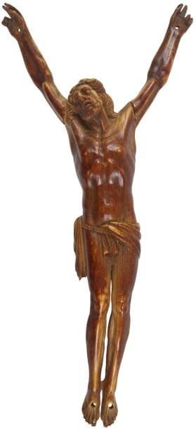Christ en ivoire sculpté, patine brune, tête levée vers le ciel, périzonium retenu par une cordelette, jambes et pieds parallèles. XVIIe siècle Hauteur: 20,8 cm