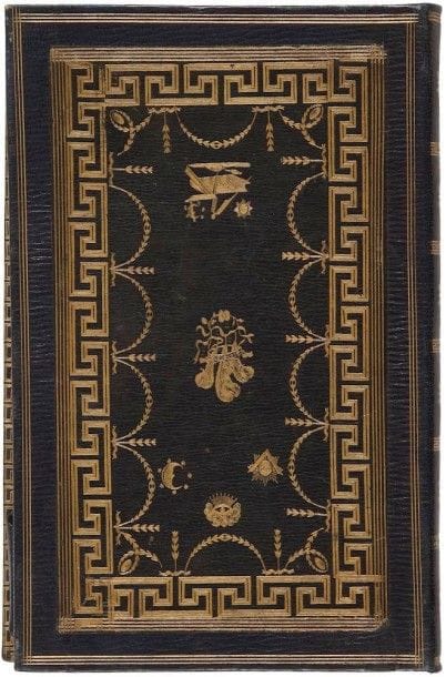 Superbe reliure en veau bleu ornée de motifs dorés aux fers d’une bordure à l’antique contenant des symboles maçonniques. XIXe siècle. (13,5 x 21 cm).