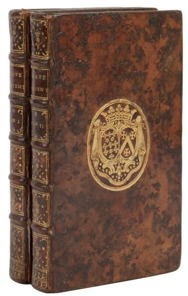 [CAYLUS (Anne Claude Philippe de Pestels de Lévis de Tubières-Grimoard, comte de)]
Contes orientaux, tirés des Manuscrits de la Bibliothèque du Roy de France. La Haye, 1743. - 2 volumes in-12, (4 ff.), 312 pp., (4 ff.), 4 planches; (1 f.), 331 pp., 4 planches. Veau marbré, armes dorées au centre des plats, dos à nerfs orné, tranches rouges (reliure de l'époque).


Cohen, 209.
Édition originale de ce recueil de contes orientaux composés par le comte de Caylus qu'il prétend issus de manuscrits de la bibliothèque du roi. Elle est illustrée de 8 gravures hors texte non signées.
EXEMPLAIRE AUX ARMES DE MADELEINE-ANGÉLIQUE DE NEUFVILLE DE VILLEROY, DUCHESSE DE BOUFFLERS (1707-1787), dame du palais de la reine.
Charnière du premier plat du premier volume fendue, petite fente à celle du second volume. Quelques discrètes restaurations, manque les gardes blanches à la fin de chaque volume. Mouillures, manque à l'angle supérieur des feuillets E2 et E3 dans le second volume