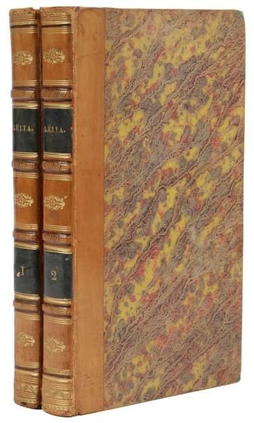 SAND (George)
Lélia. Paris: Henri Dupuy, L. Tenré, 1833. - 2 volumes in-8, (4 ff.), 350 pp.; (3 ff.), 383 pp. Demi-veau fauve, dos à nerfs orné, tranches marbrées (reliure de l'époque).

Édition originale très rare avec titre portant la mention "2e édition" au premier volume, de ce roman culte de George Sand. La véritable seconde édition paraîtra dans une version très remaniée en 1839. 
Une note manuscrite, datée de 1935 sur un feuillet in-8 joint, donne ces intéressantes précisions: "Le présent exemplaire appartient en réalité à la 1e édition, mais fait partie de la 2e tranche d'exemplaires du premier tirage, avec le titre de relais, suivant l'usage de la librairie à cette époque... Notre exemplaire a échappé à la destruction à peu près complète de la 1e puis de la 2e tranche, dite ici seconde édition, de même année, comprenant les pièces incriminées disparues dans les autres éditions, destruction par ordre du Gouvernement de l'époque par les soins de la famille d'Alfred de Musset. C'est pourquoi il n'en existe que quelques rares exemplaires dans le cabinet de certains bibliophiles". 
Exemplaire en reliure de l'époque. Charnière du premier plat du tome 1 fendue mais solide, petites craquelures aux autres charnières. Très bon état intérieur. 
Provenance: D. Deville, de la Compagnie d'Assurance La Nationale, né en 1834 et mort vers 1914, avec son bel ex-libris représentant les cathédrales de Rouen et de Paris. La vente de sa bibliothèque se déroula en août 1915 à Paris