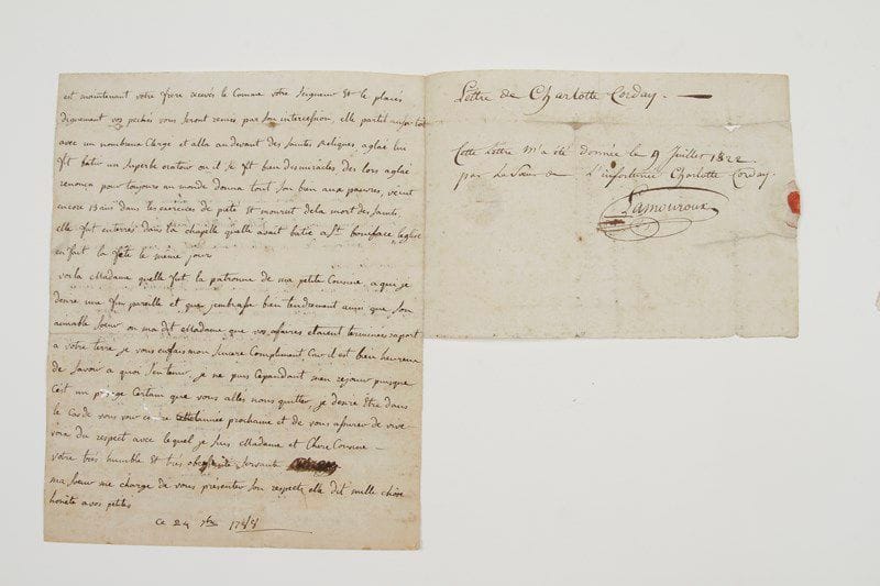 Marie-Anne-Charlotte de Corday d'Armont, dite Charlotte Corday (1768-1793) jeune fille normande, noble et pieuse, elle assassina Jean-Paul Marat, et fut guillotinée.Lettre autographe [signature «Corday» cancellée], [Caen] 24 septembre 1788, à Mme Duhauvelle en sa terre des Authieux; 2 pages in-4, adresse avec cachet de cire rouge brisé et marque postale de Caen (quelques infimes trous de ver, le bas du feuillet d'adresse manque).Rarissime lettre à une cousine, témoignage de sa piété alors qu'elle est pensionnaire à l'abbaye aux Dames de Caen.«Jaurais eu lhonneur Madame de vous ecrire plutôt et de vous remercier de votre souvenir, mais il ma fallu feuilleter toutes les vies de Saints pour trouver la patronne de ma petite cousine dont je vais vous dire la vie en peu de mots. Il y avait à Rome vers l'an 300 une femme de qualité nommée Aglaé, elle possedait des richesse immense et menait une vie très dissipée, elle navait que 3 bonnes qualités, l'hospitalité, la liberalité, la compassion. Après plusieurs années passées dans le crime, Aglaé touchés de la grâce dit a Boniface son intendant aussi convertit, daller assister les Saints martirs et de lui en aporter des reliques afin de les honorer et dobtenir par leurs intercession la remission de ses pechés. Boniface lui dit en plaisantant, Si je trouve des reliques des martyrs je les aporterai, mais Madame si mes reliques vienne sous le nom des martyrs recevés les. En effet Boniface assistant les Saints fut condamné a mort et eu la tête tranchée. Ses domestiques remporterent son corps. Cepandant un ange aparut a Aglaé et lui dit Celui qui était votre serviteurs est maintenant votre frere recevés le comme votre Seigneur et le placés dignement vos pechés vous seront remis par son intercession, elle partit aussitôt avec un nombreux Clergé et alla au devant des Saintes Reliques. Aglaé lui fit batir un superbe oratoir ou il se fit bien des miracles. Des lors Aglaé renonça pour toujours au monde donna tout son bien aux pauvres, v