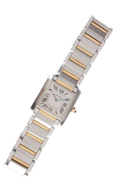 CARTIER
Montre bracelet de dame en or et acier. Modèle TANK, français. Mouvement à quartz.Poids brut: 81,62 g