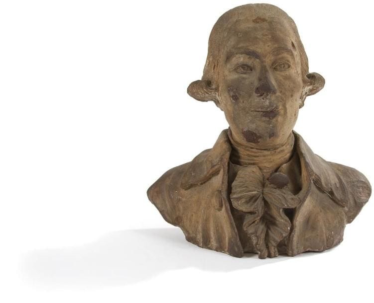 Petit buste d'homme en terre-cuite.
XVIIIe siècle (accidents et restaurations).
H.: 35 cm
