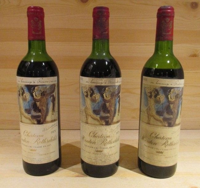 12 bouteilles CHÂTEAU MOUTON ROTHSCHILD, GCC1 Pauillac, 1973 (1 M.E. - 2 M.E - 2 B.E. - 6 B.E - 1 V - e.t.h - 4 c.l.a.).