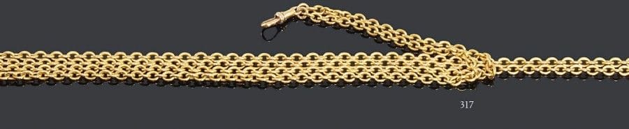 Chaîne giletière en or jaune 18K, maillons jaserons. Poids: 30,7 g