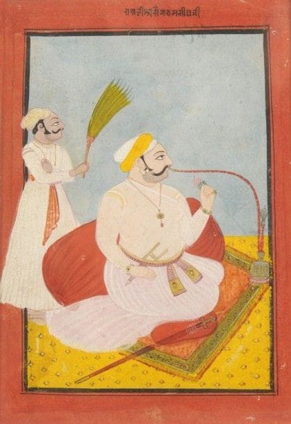 Raja fumant le huqqa, Rajasthan, Bundi, XIXe siècle. 
Gouache sur page d'album cartonnée à marges rouges. Inscription nagari en haut de la marge. Appuyé contre un coussin, le raja, vêtu d'une robe blanche, un katar glissé dans la ceinture, et son talwar posé à côté de lui, est assis sur un tapis jaune à fleurettes. Derrière lui, un serviteur l'évente avec un morchal tandis qu'il fume le narghilé, une rose dans la main gauche.
Dim. à vue page: 22 x 15,5 cm
Raja smoking a huqqa, Rajasthan, Bundi, 19th century 