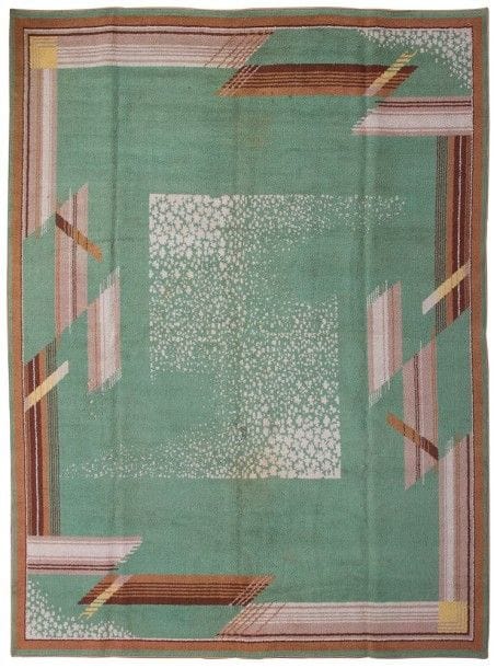 Attribué à Éric BAGGE (1890-1978) Décorateur & Lucien BOUIX Éditeur

Grand tapis rectangulaire en laine.
Décor de motifs géométriques.
État d'usage.
Circa 1928/30.
315 x 267 cm"