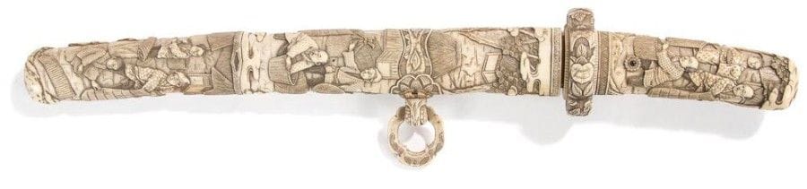 JAPON - Epoque MEIJI (1868 - 1912)

Tanto, avec fourreau en ivoire à patine jaune à décor sculpté de paysans et enfants.
L. totale: 39 cm